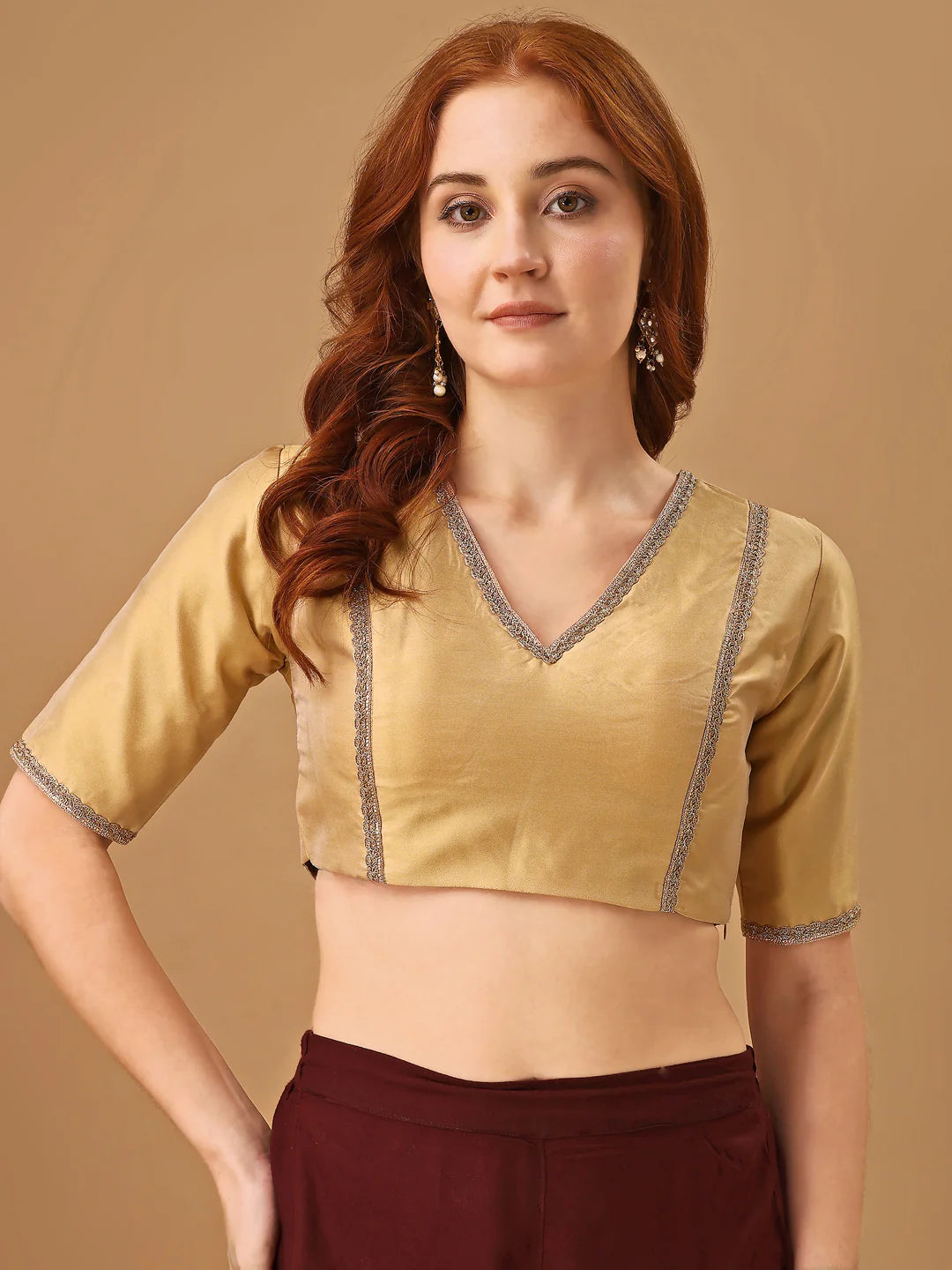 Beige colored half sleeves tafeta blouse with lace embellishments