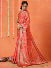 Peach colored art silk woven designer saree with tassles on pallu