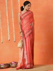 Peach colored art silk woven designer saree with tassles on pallu