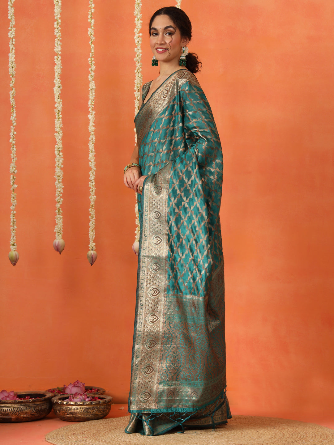 Rama colored art silk woven designer saree with tassles on pallu