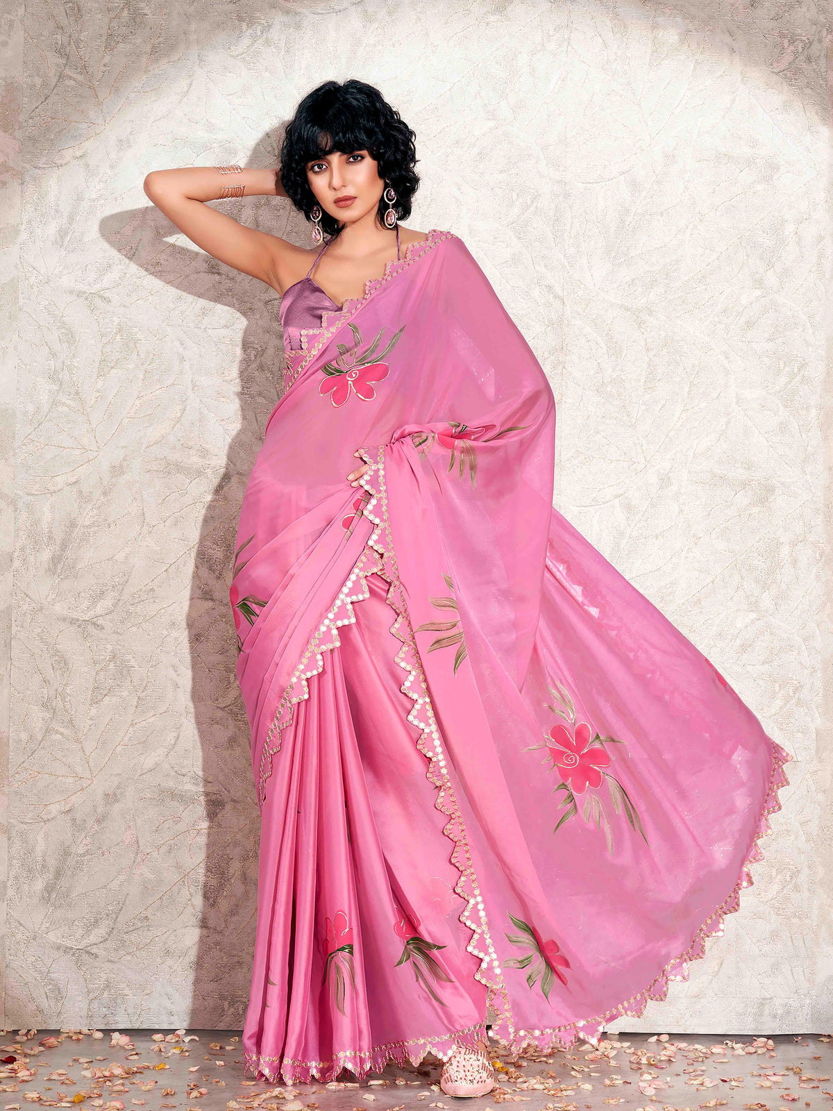 Pink colored hand printed saree with scalloped border