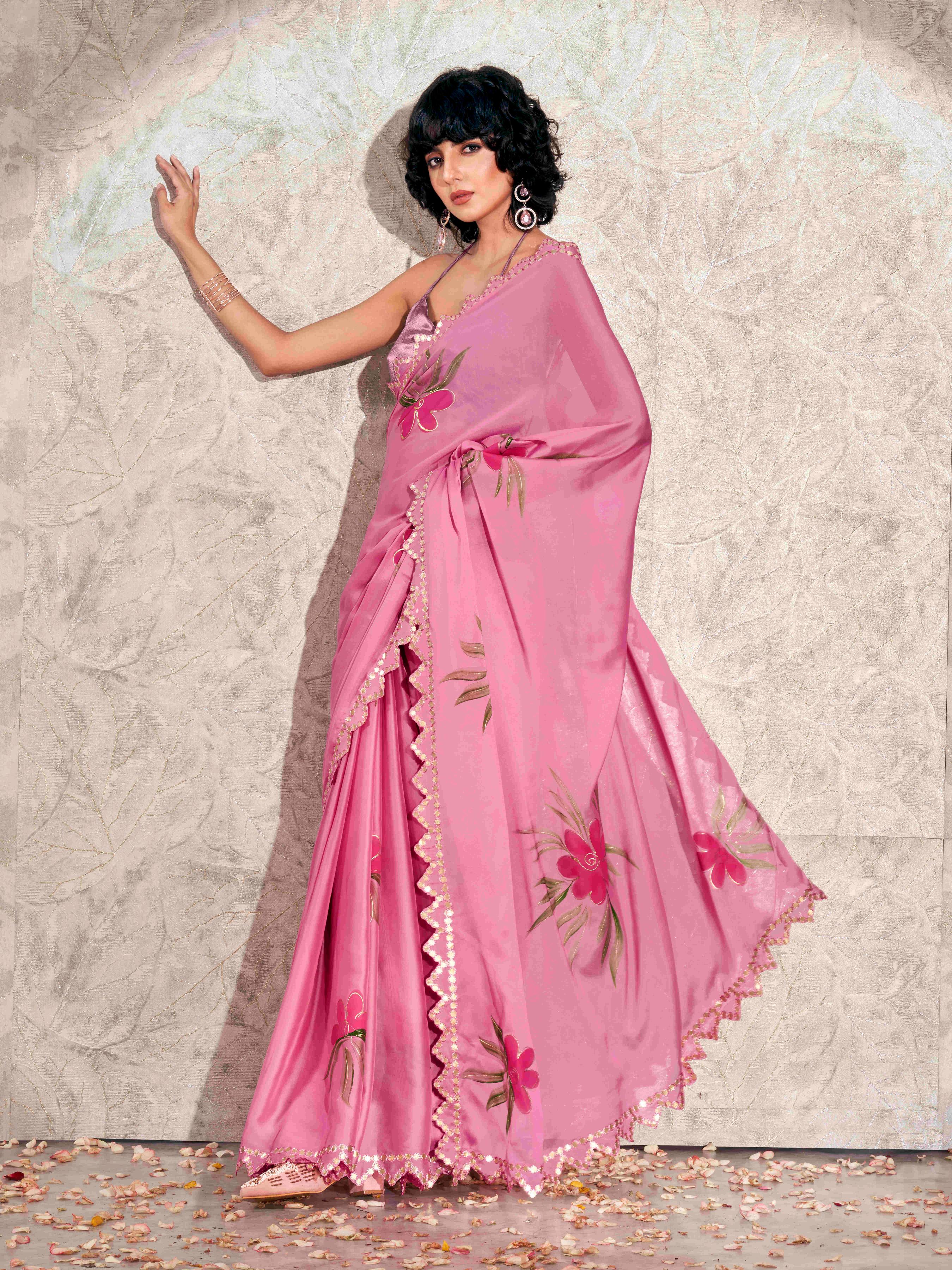 Pink colored hand printed saree with scalloped border