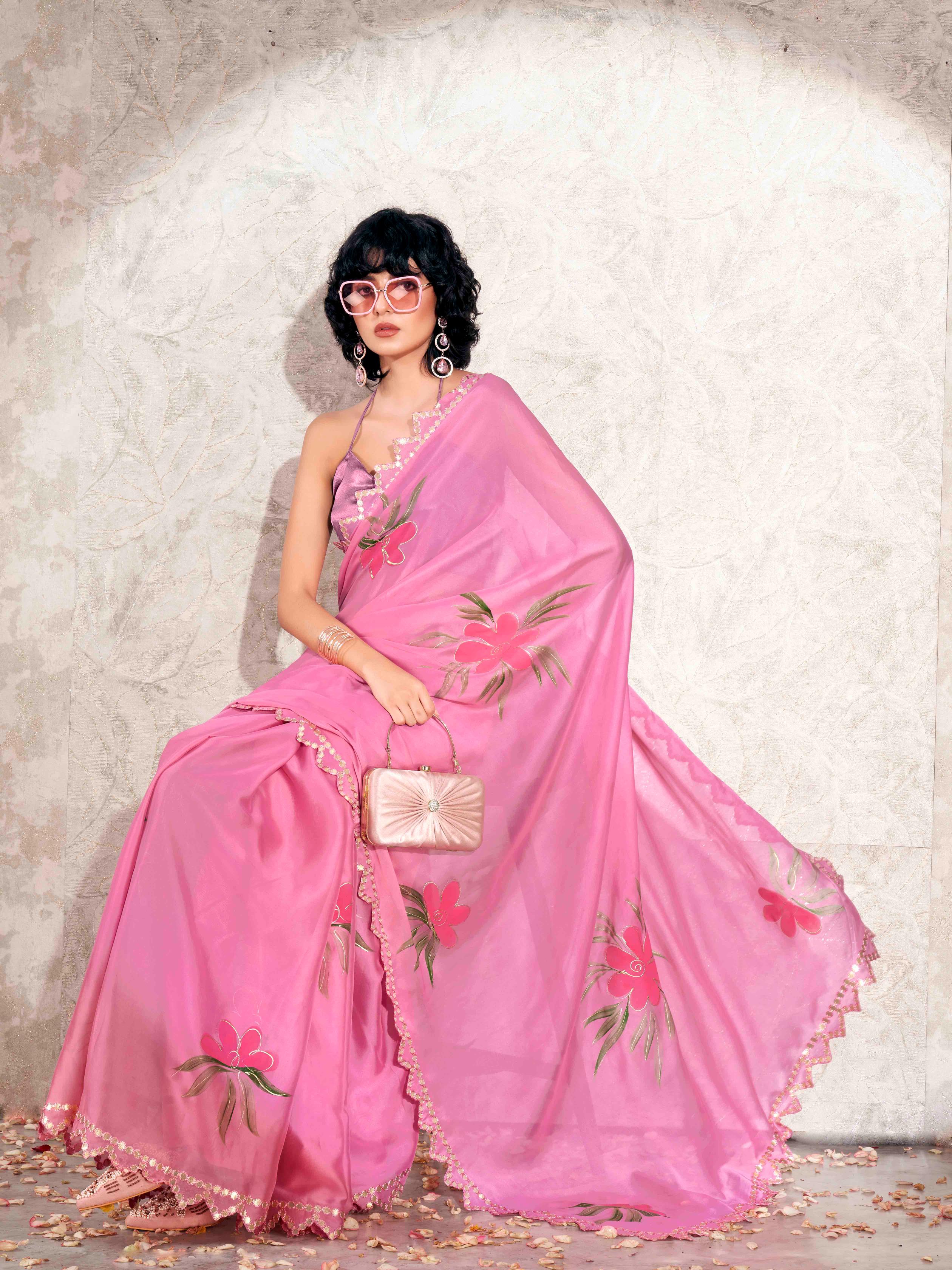 Pink colored hand printed saree with scalloped border