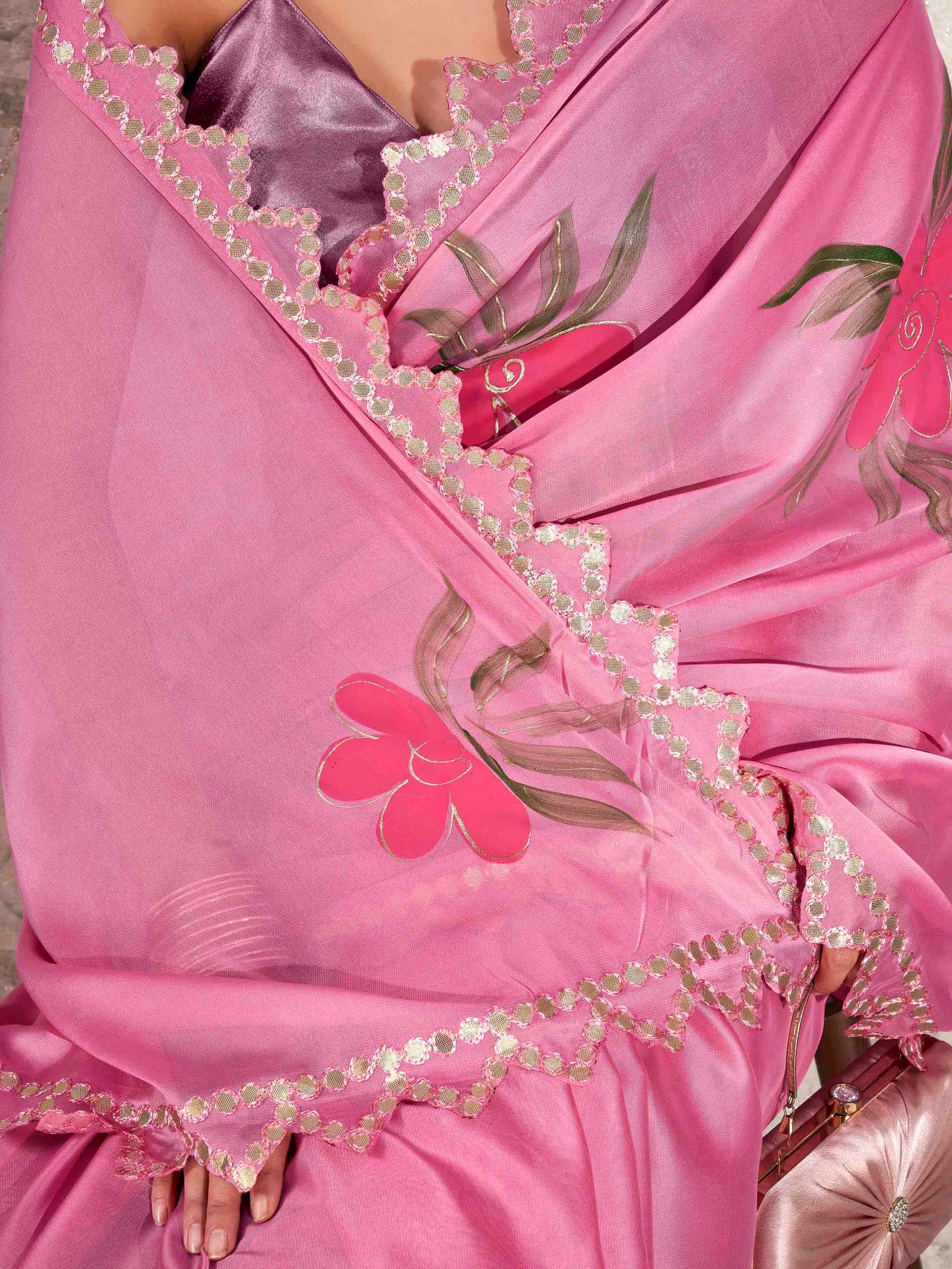 Pink colored hand printed saree with scalloped border