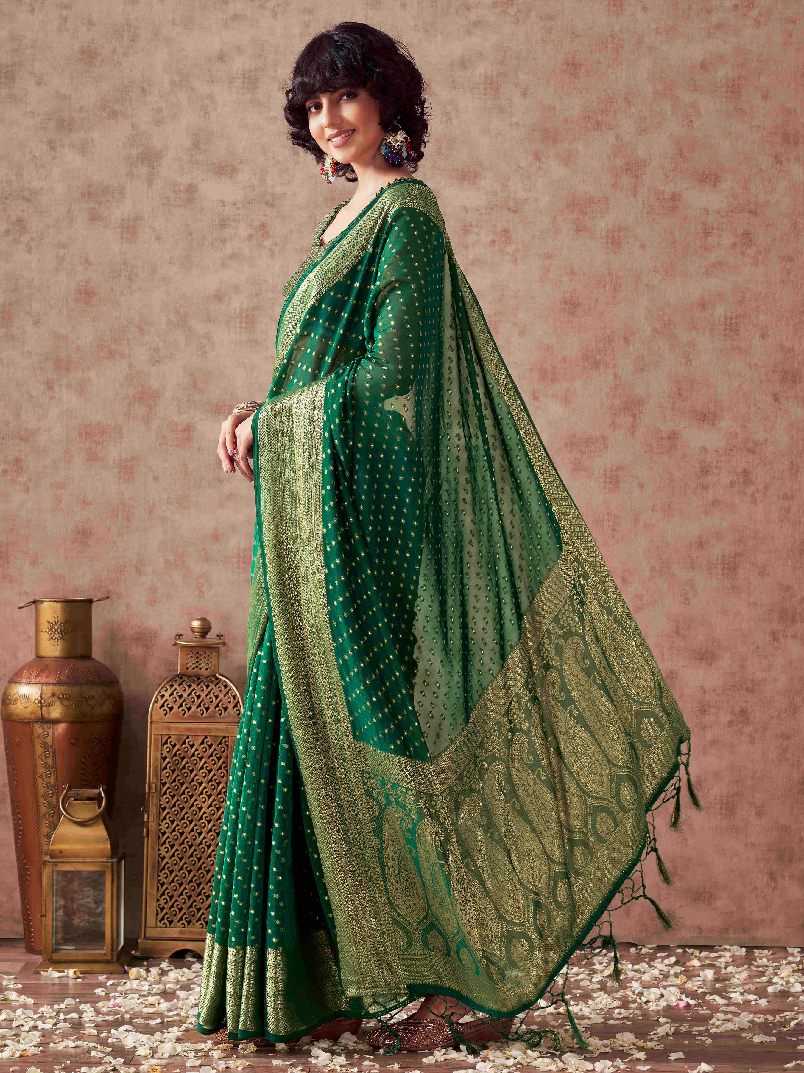 Green colored georgette woven saree