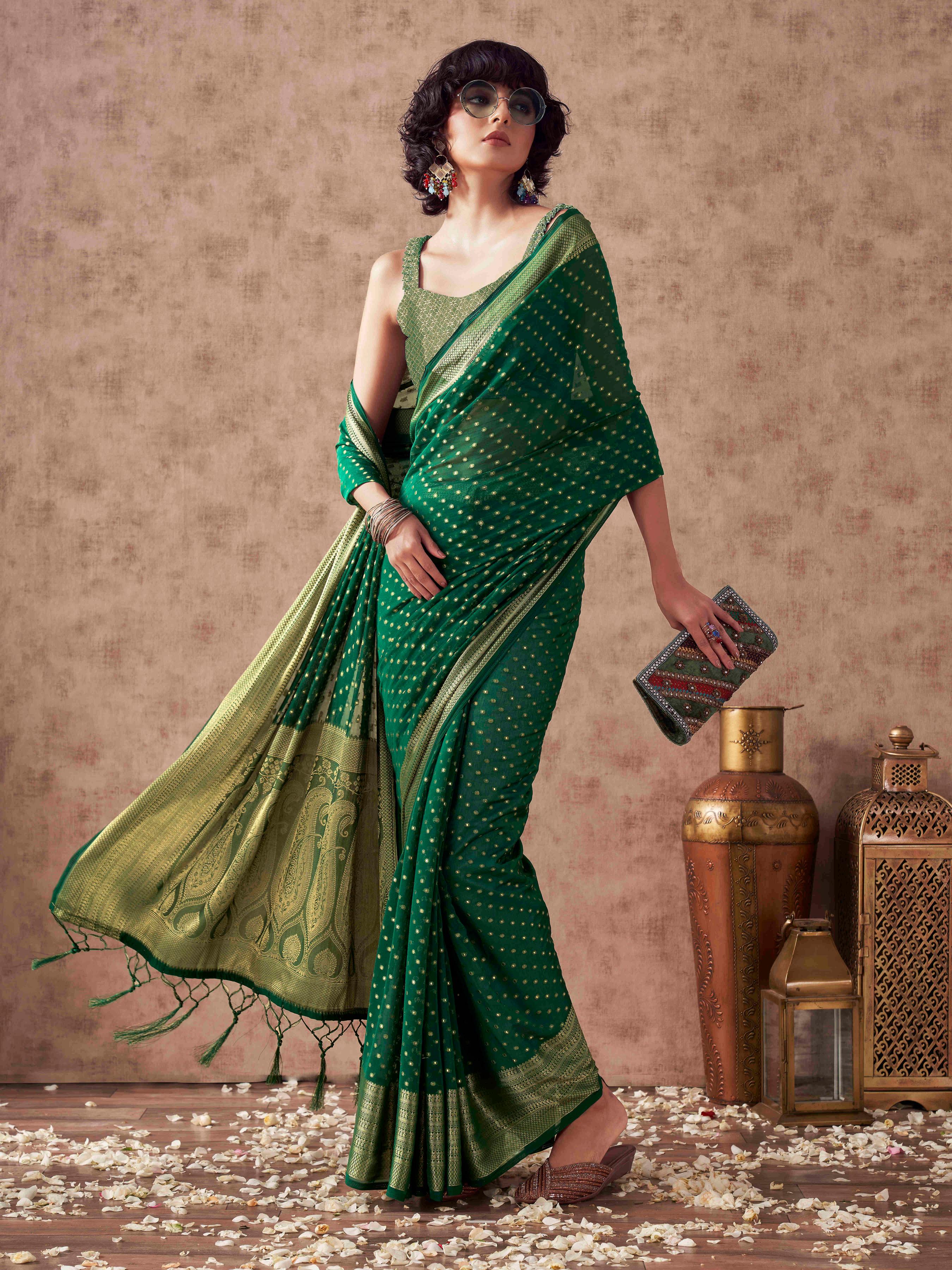 Green colored georgette woven saree