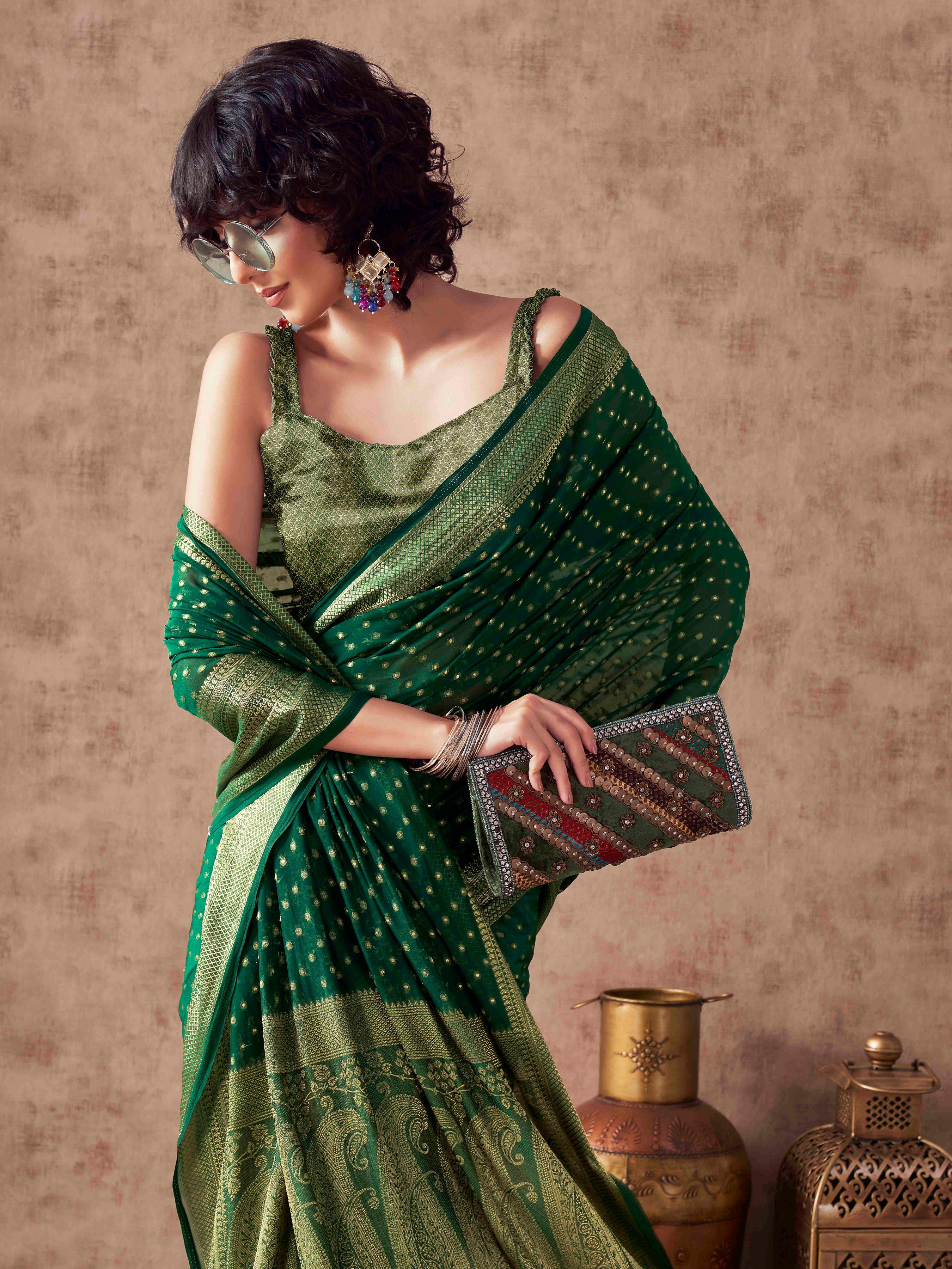 Green colored georgette woven saree