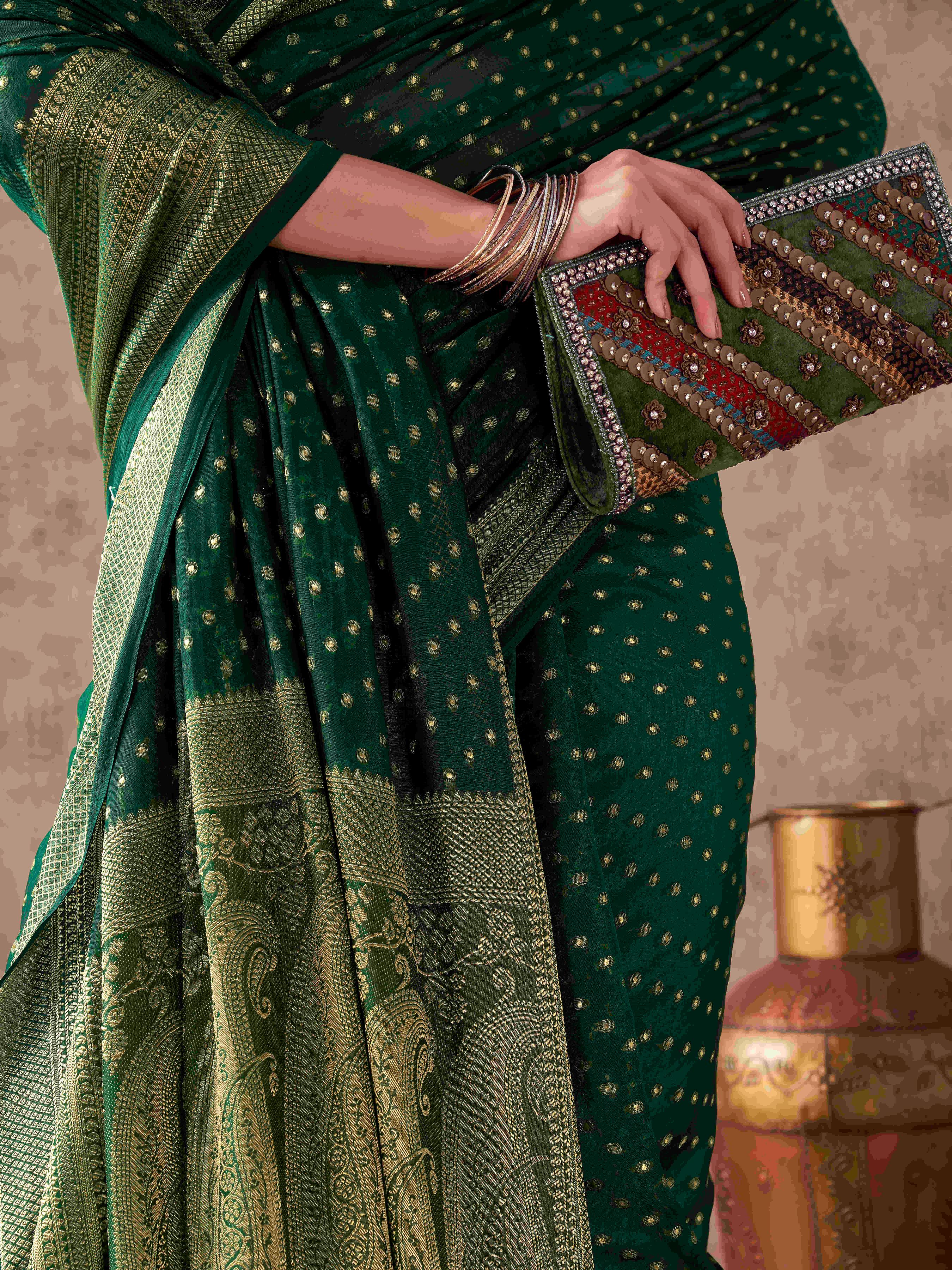 Green colored georgette woven saree