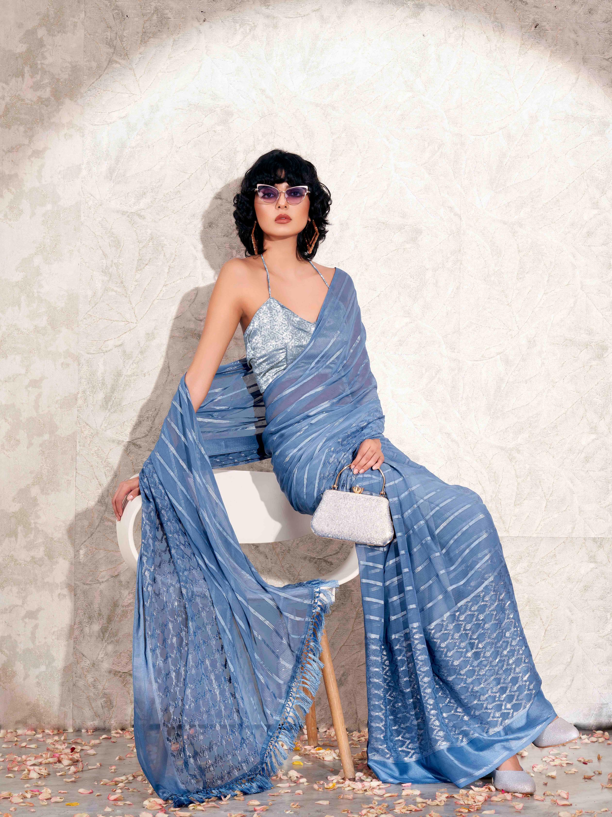 Blue colored satin striped saree