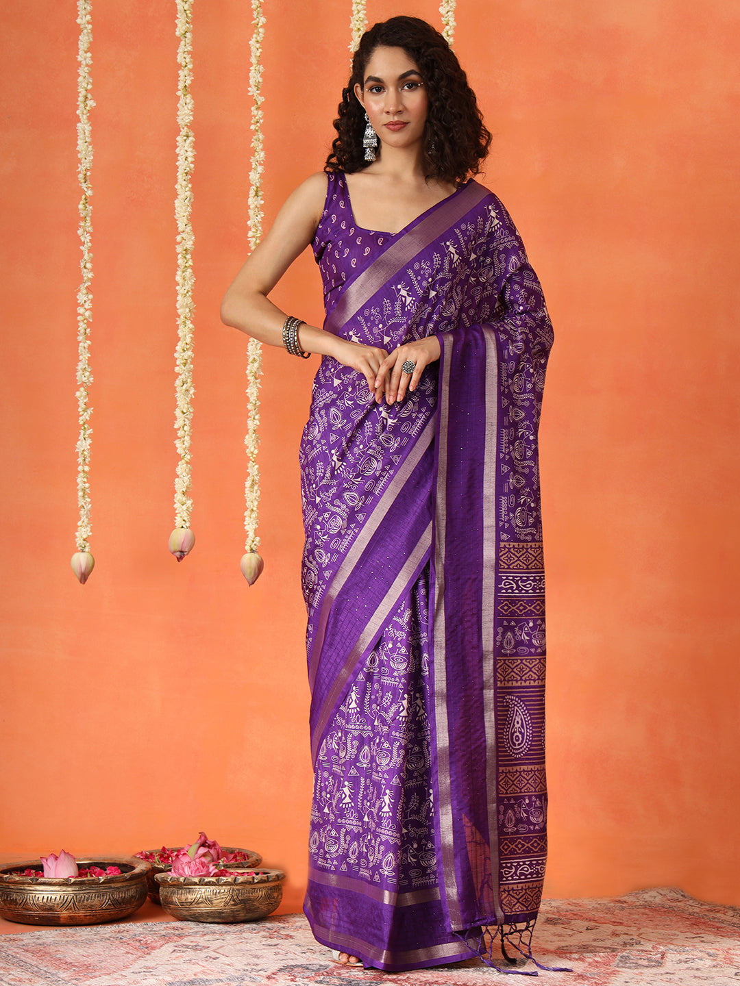 Purple colored traditional printed poly cotton saree with tassles on pallu