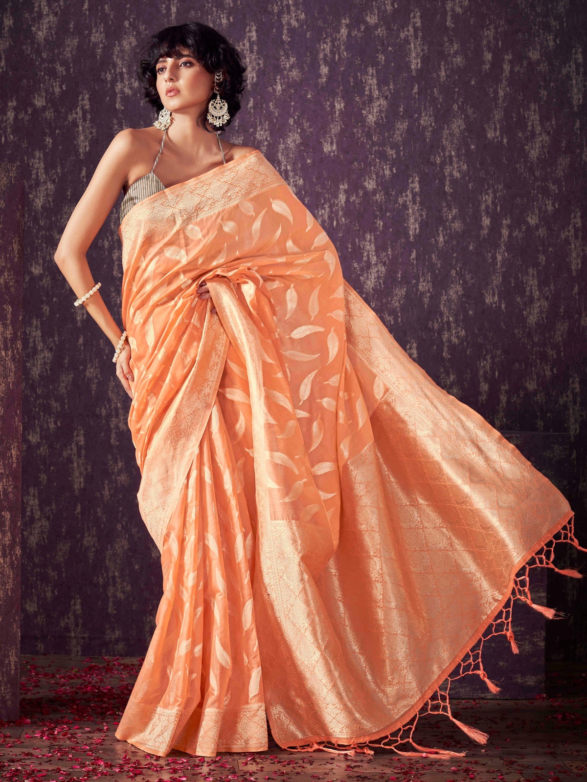 Peach colored poly cotton woven designer saree with tassles on pallu