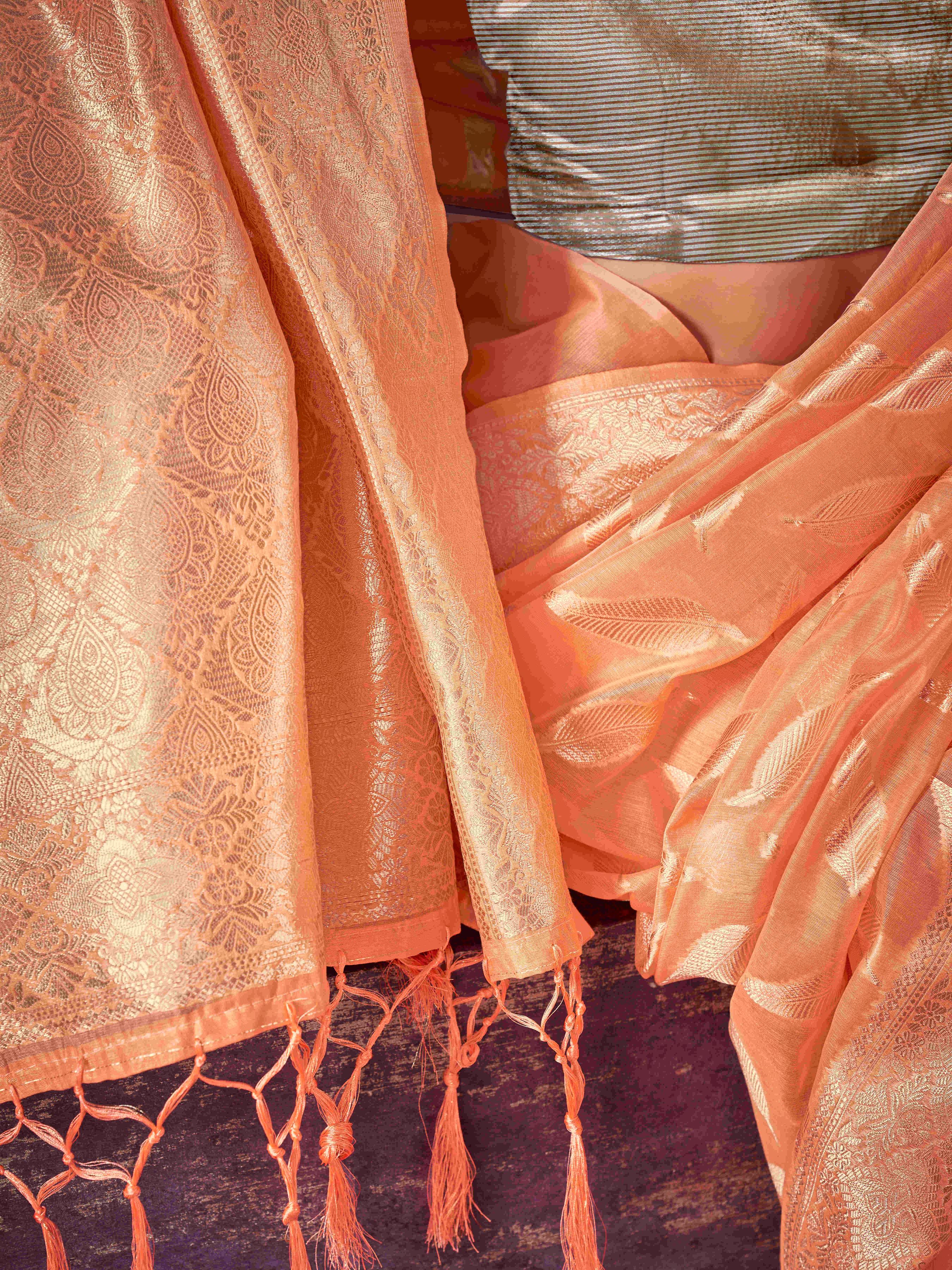 Peach colored poly cotton woven designer saree with tassles on pallu