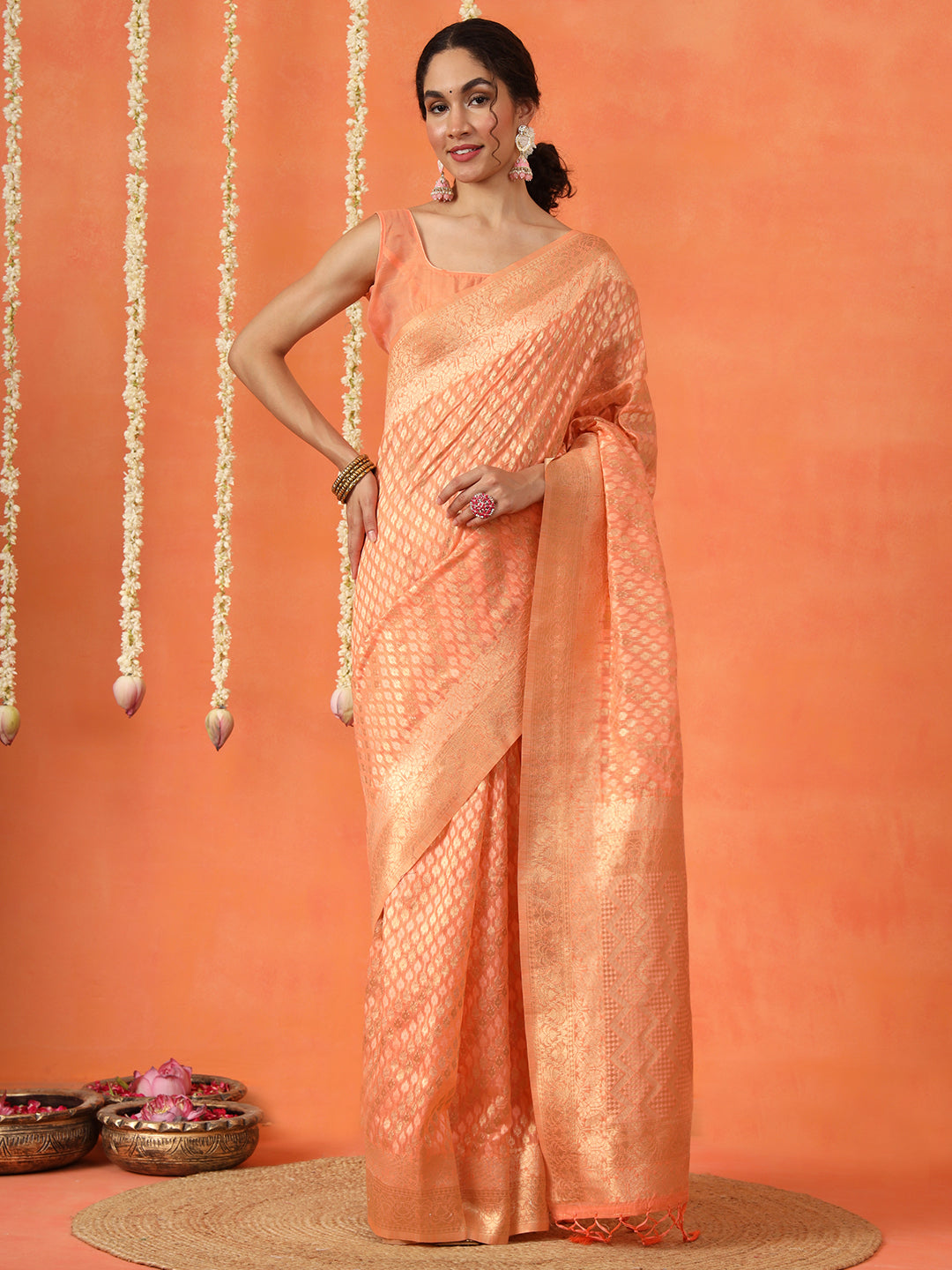 Peach colored poly cotton woven designer saree with tassles on pallu