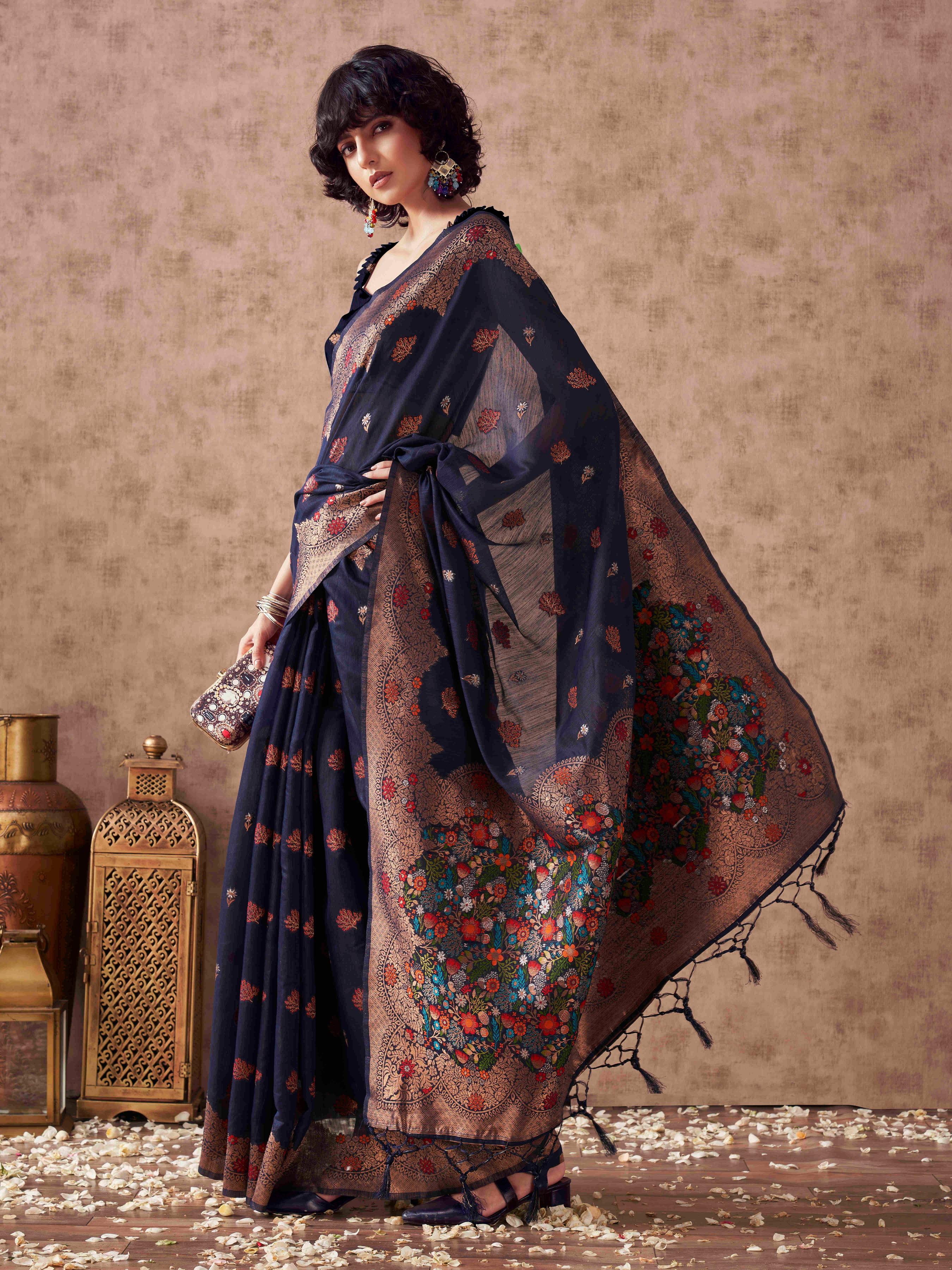 Navy blue colored poly cotton woven designer saree with tassles on pallu