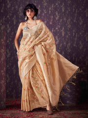 Beige colored poly cotton woven designer saree with tassles on pallu