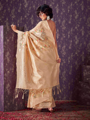 Beige colored poly cotton woven designer saree with tassles on pallu