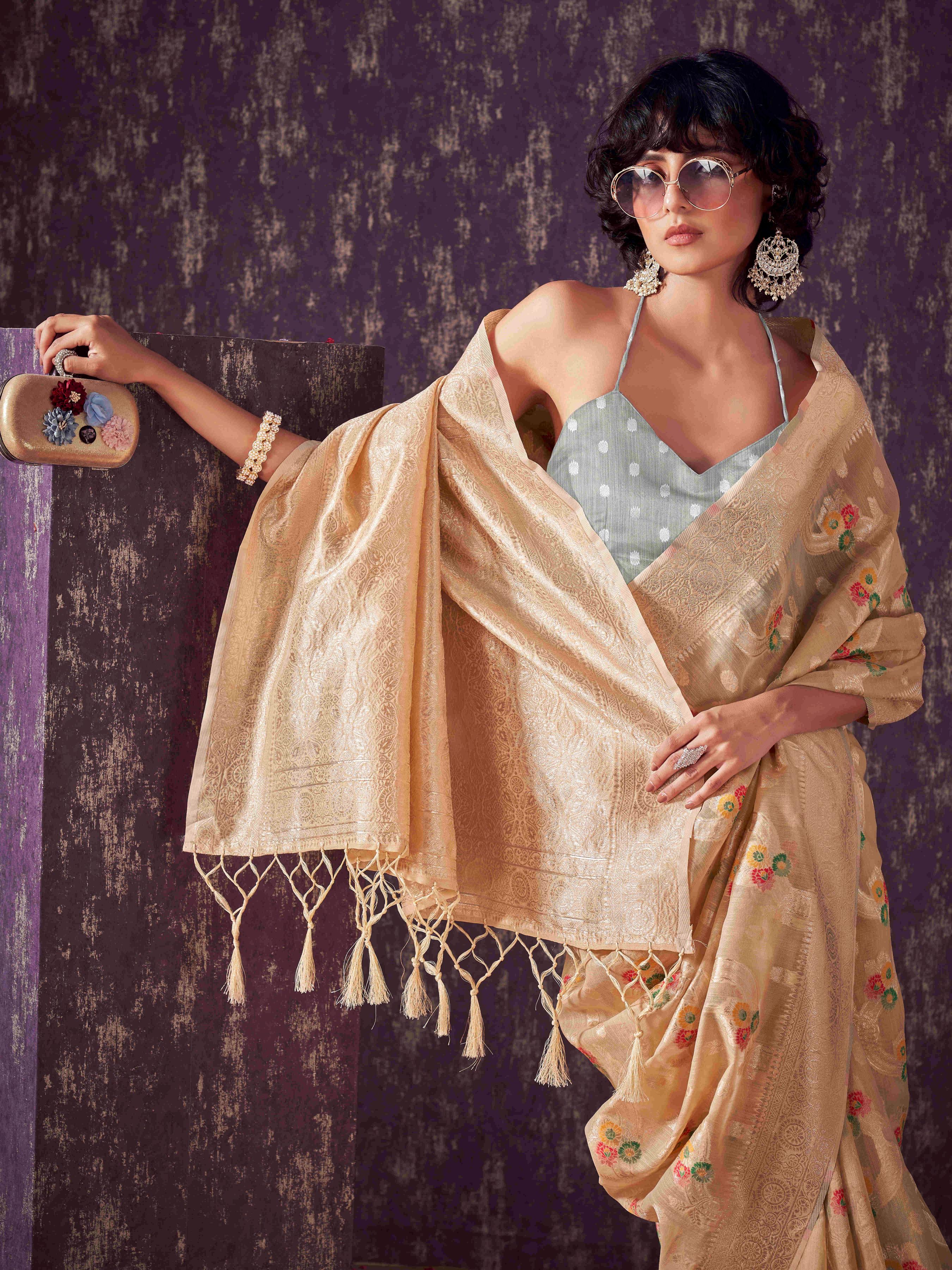 Beige colored poly cotton woven designer saree with tassles on pallu