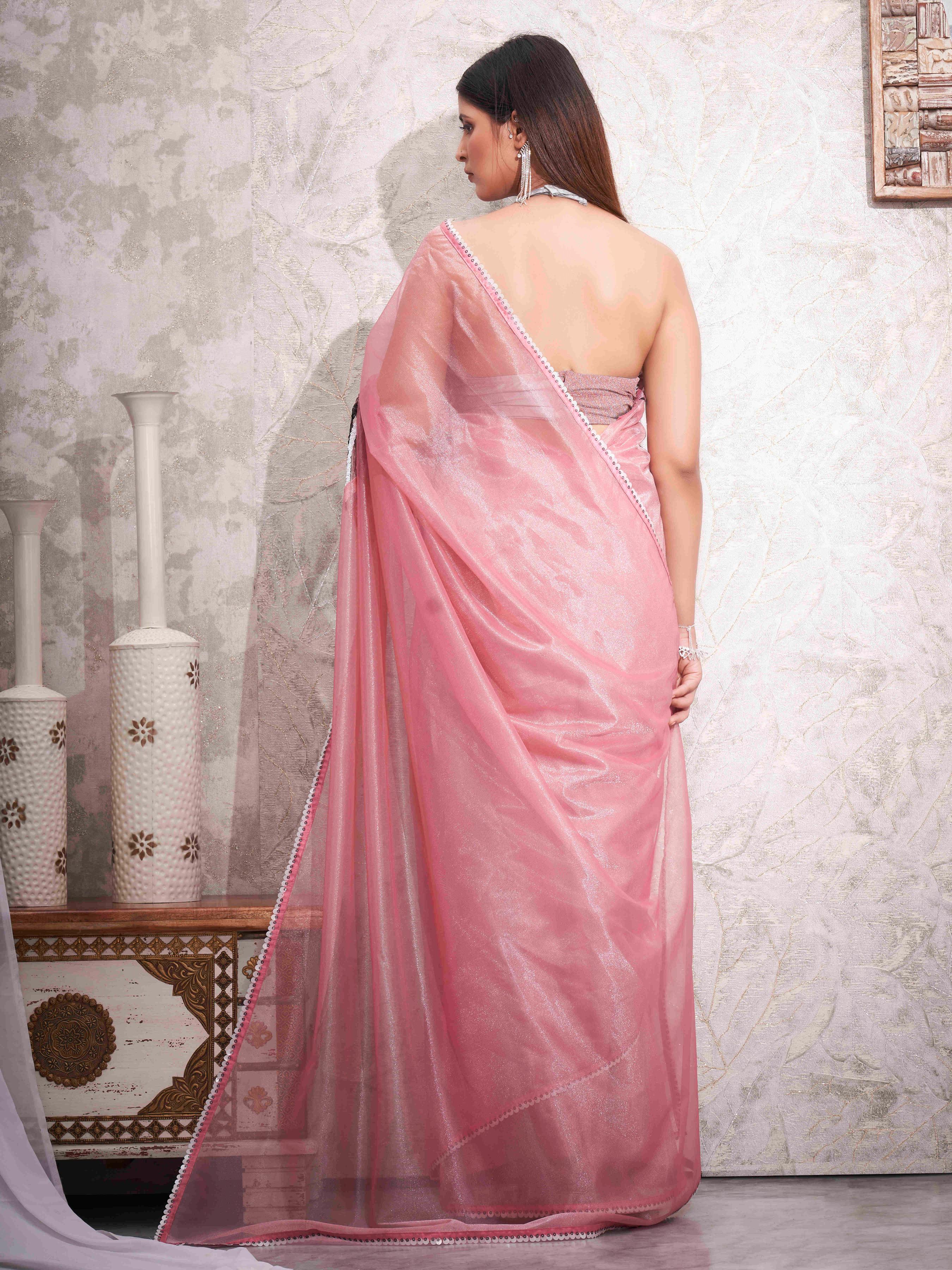 Pink colored shimmer net designer saree with sequence embroidery on shoulder and sequinned lace