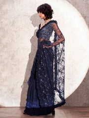 Blue colored half and half net and jacquard saree with embroidered pallu frill and tassles in patli