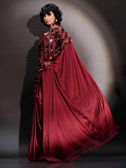 Maroon colored satin saree with sequin embroidery on shoulder portion and tassles on pallu