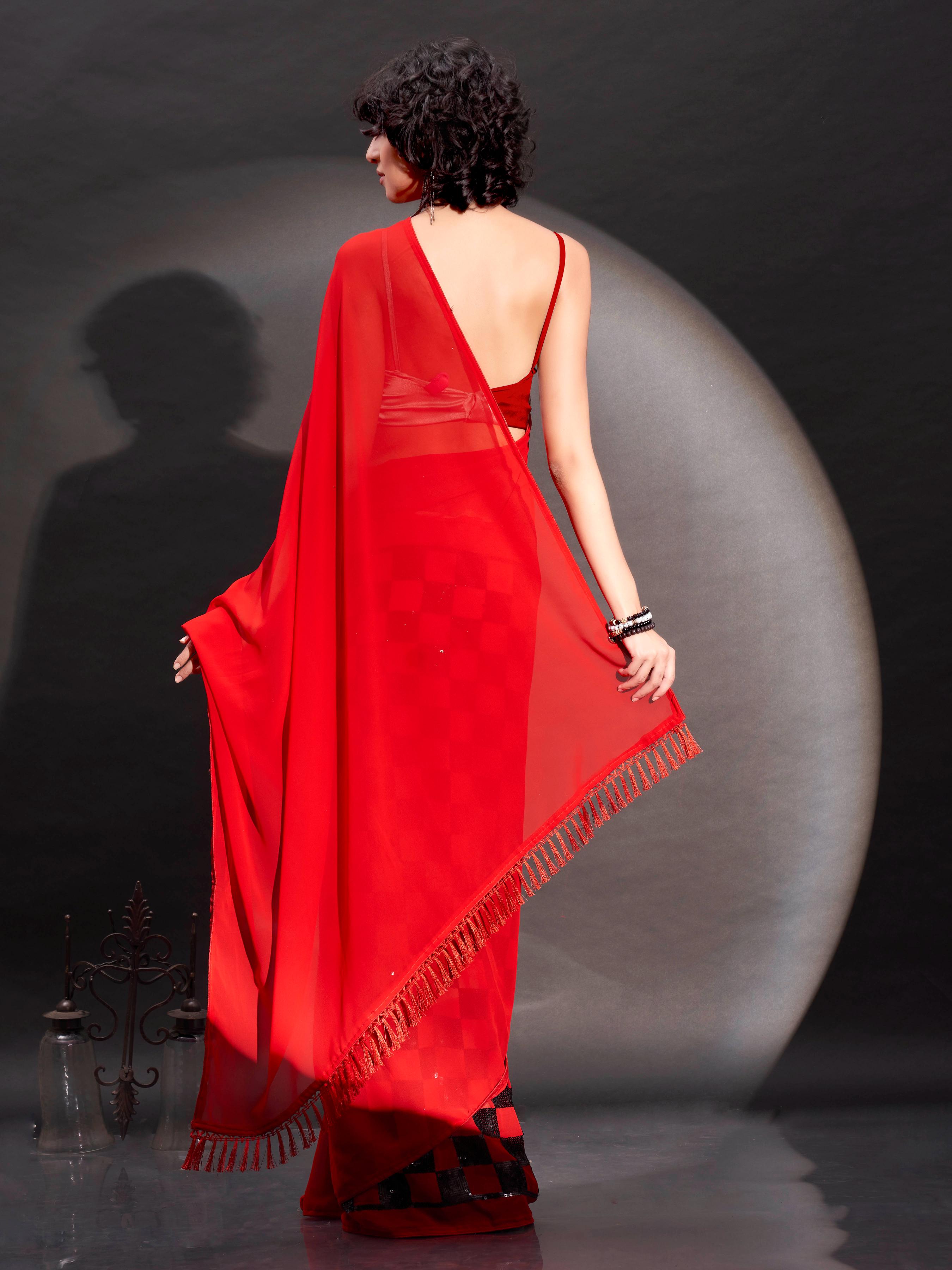 Two way wearbable red sequinned georgette saree with tassles on pallu