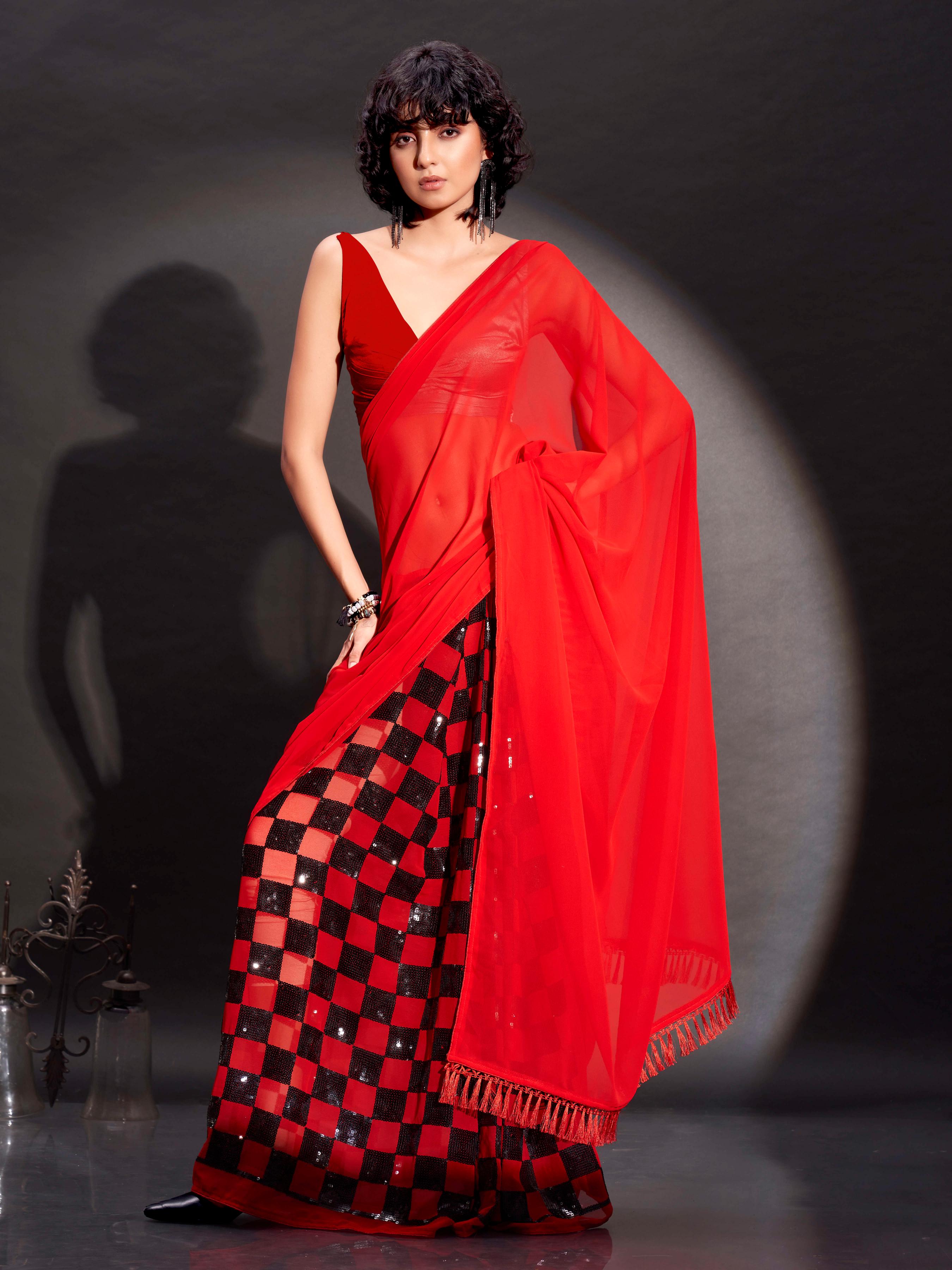 Two way wearbable red sequinned georgette saree with tassles on pallu