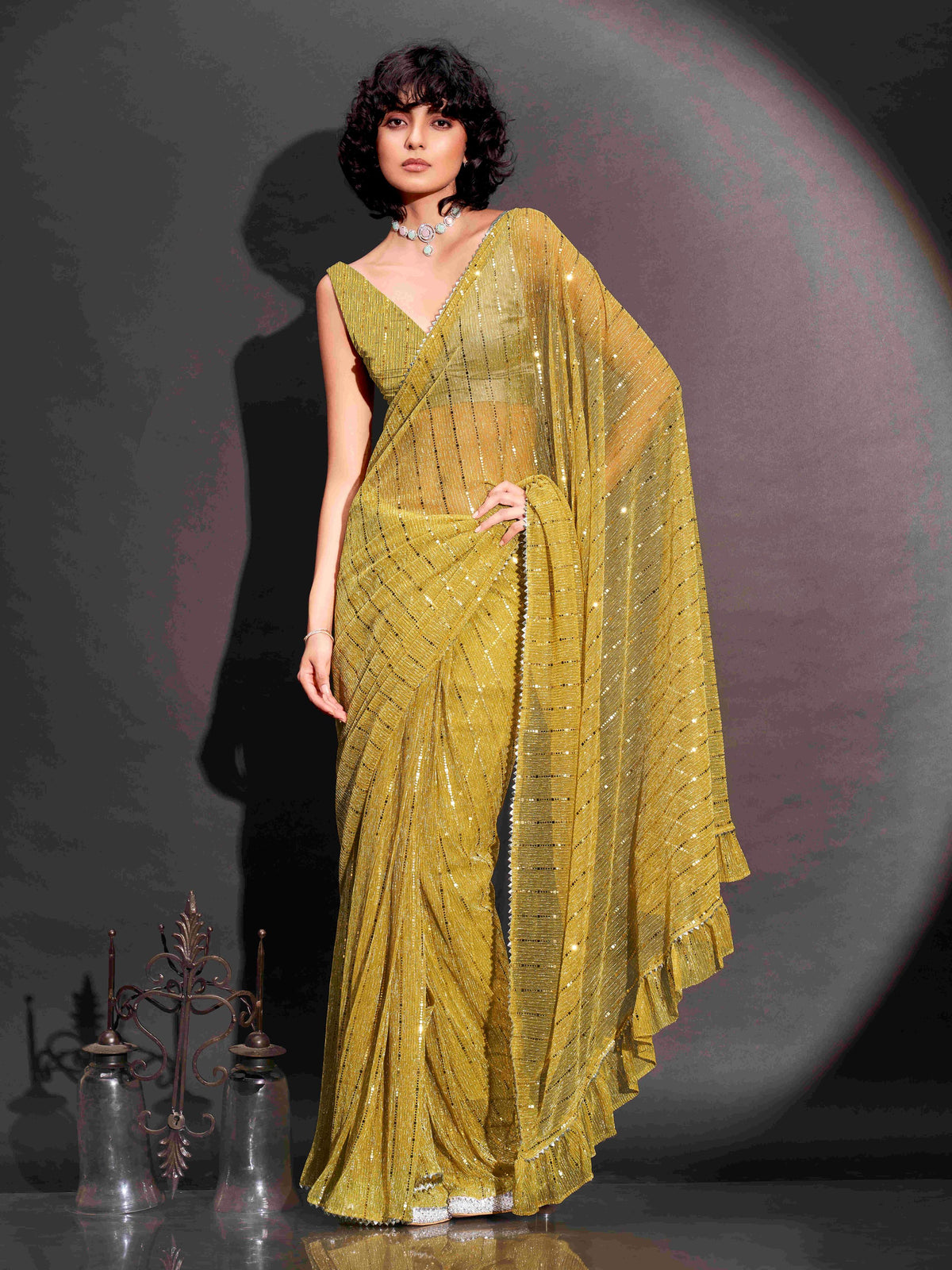 Ready to wear yellow colored lycra saree with foil embellishments and frill on pallu