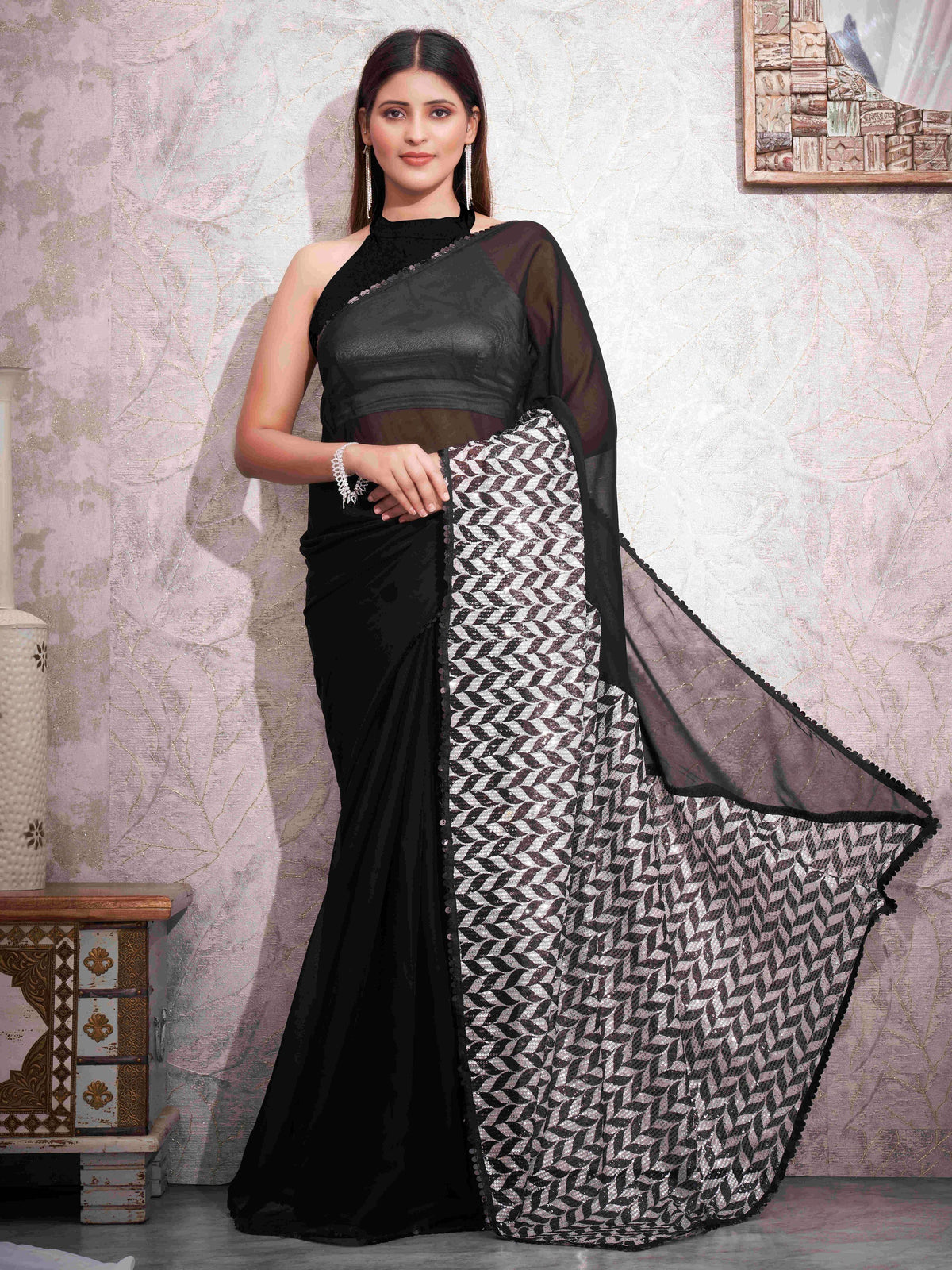 Black colored designer satin saree with sequence printed net and sequence border