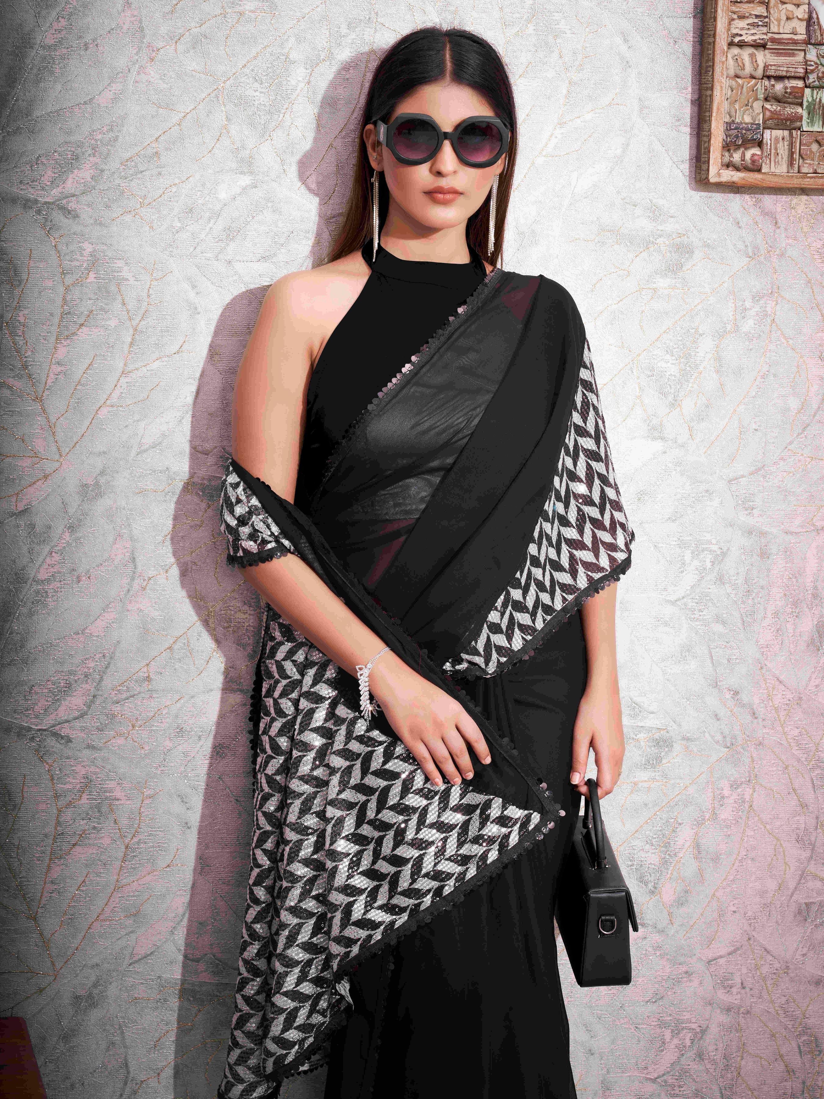 Black colored designer satin saree with sequence printed net and sequence border