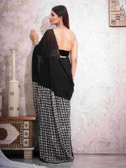 Black colored designer satin saree with sequence printed net and sequence border