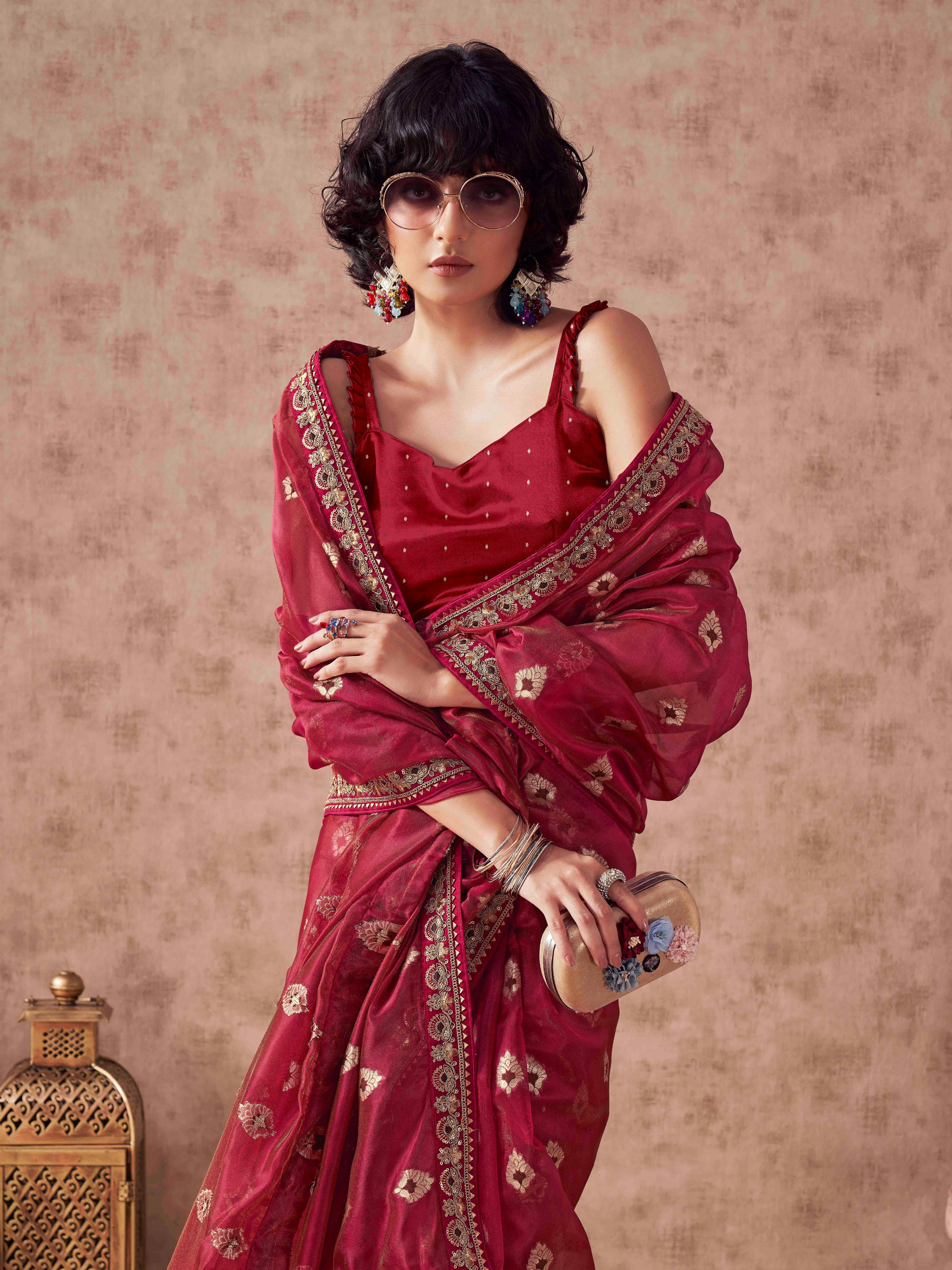 Pink colored linen jacquard saree with embroidered lace