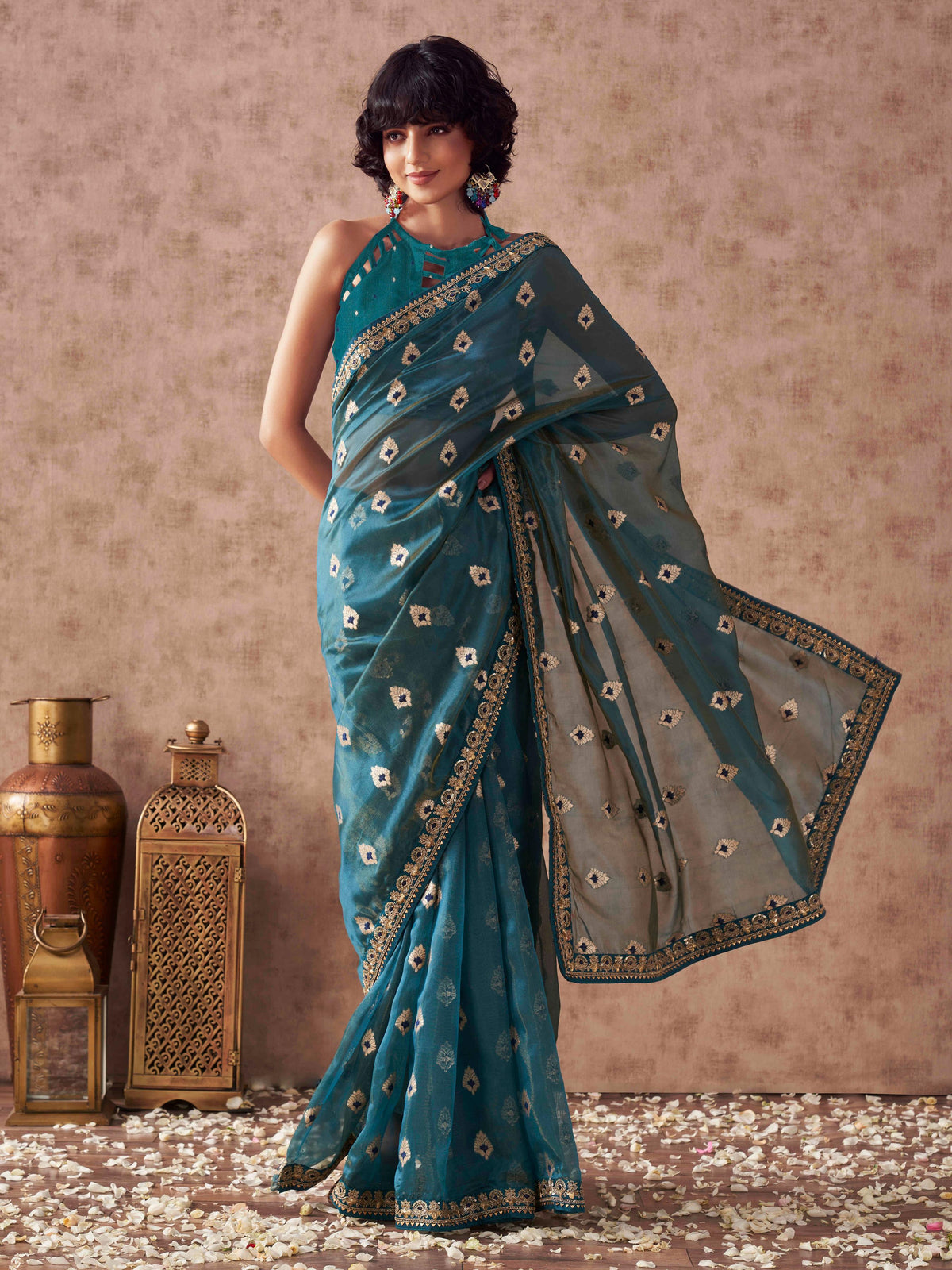 Teal colored linen jacquard saree with embroidered lace