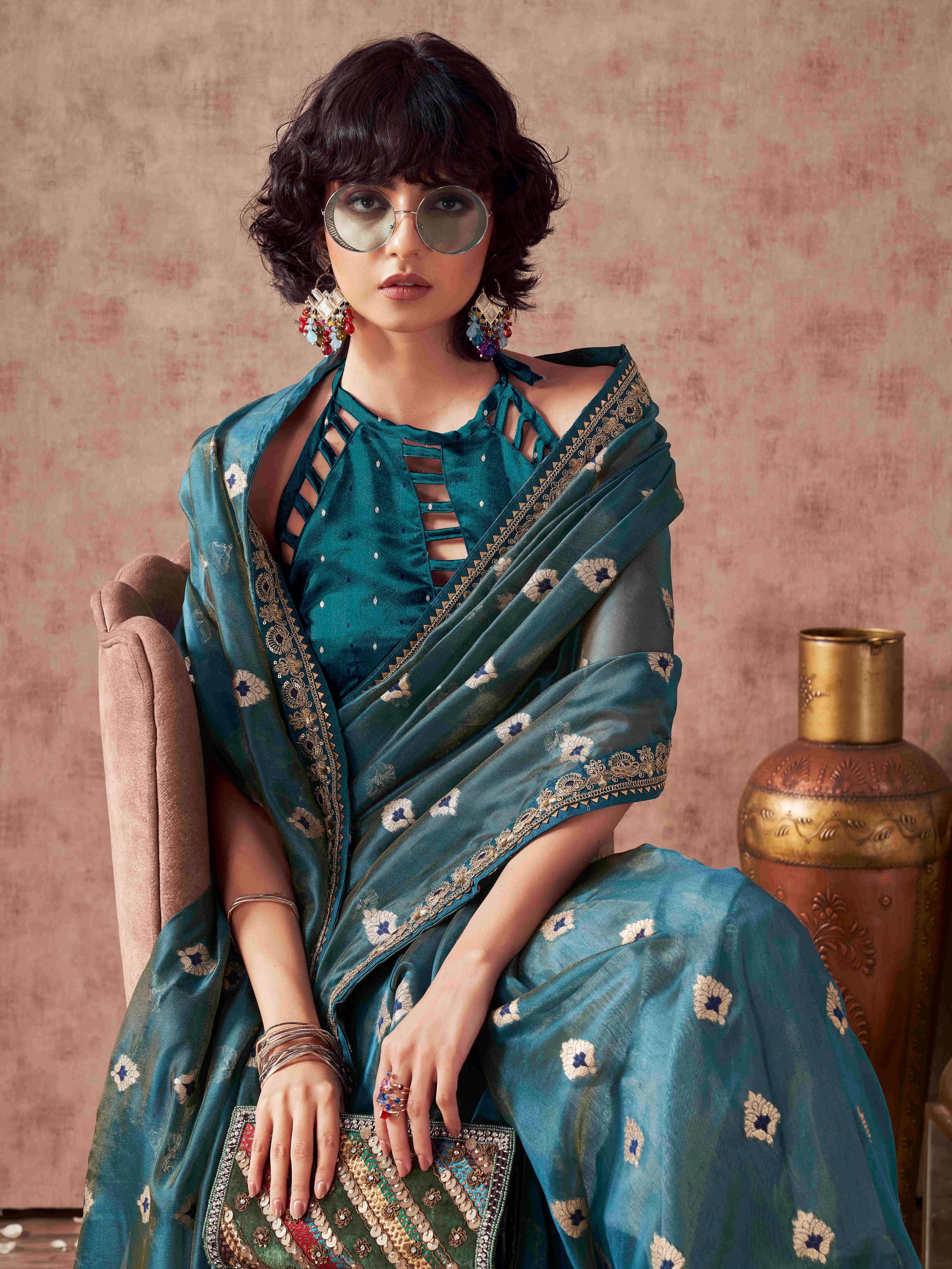 Teal colored linen jacquard saree with embroidered lace