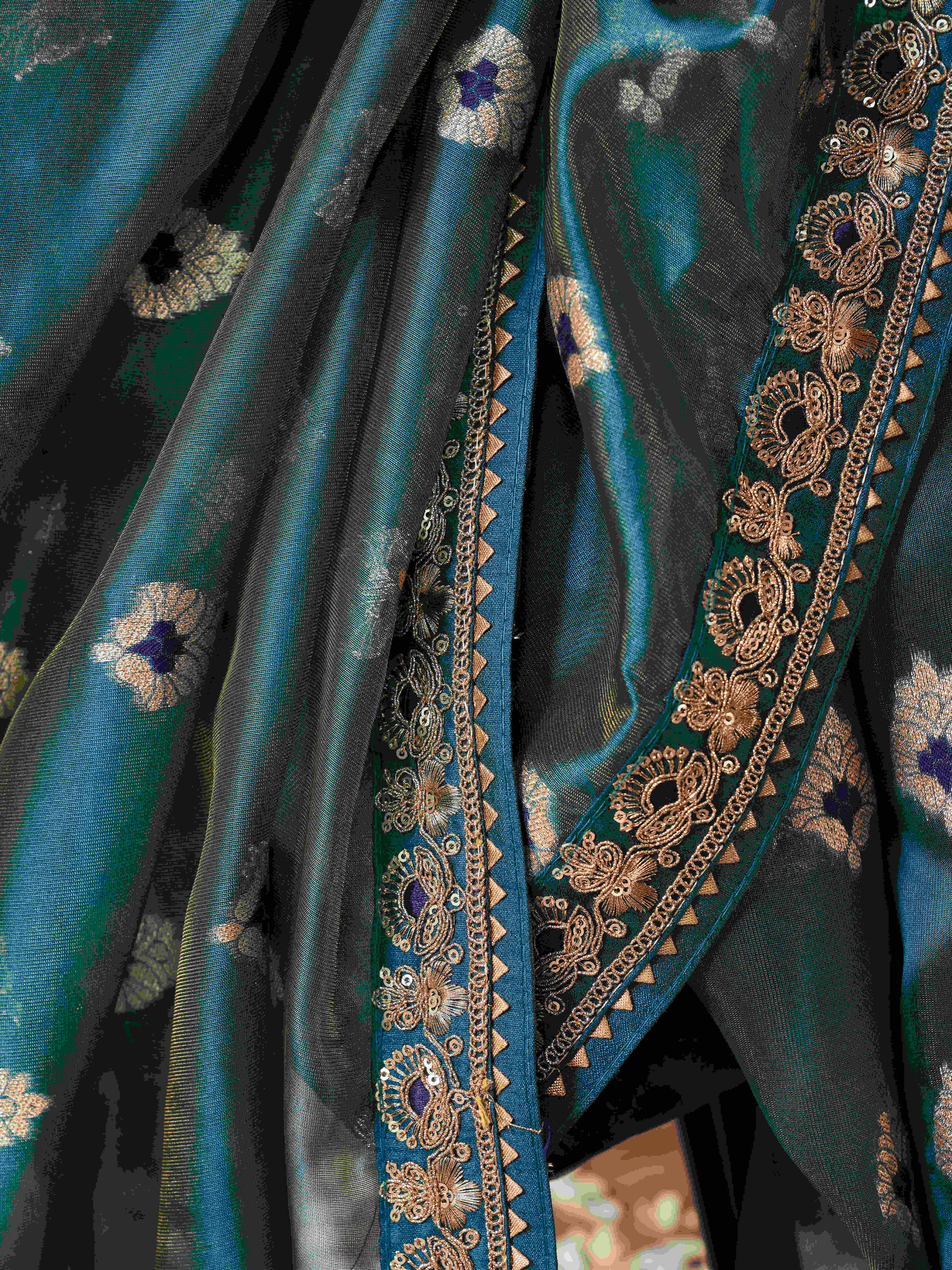 Teal colored linen jacquard saree with embroidered lace