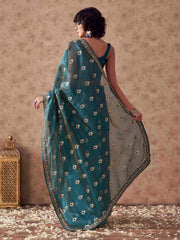 Teal colored linen jacquard saree with embroidered lace