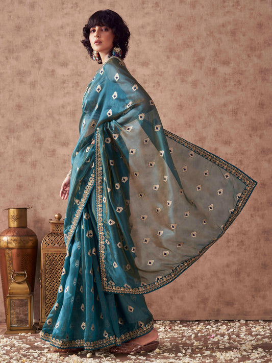 Teal colored linen jacquard saree with embroidered lace