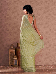 Pista green colored striped satin chiffon saree with mirror embroidery on pallu and scalloped border