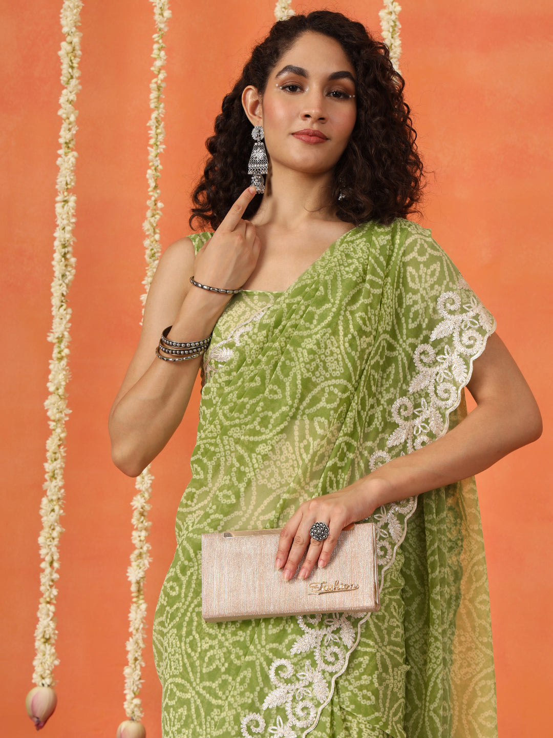 Green colored poly georgette bandhni saree with gota patti c-pallu embroidery