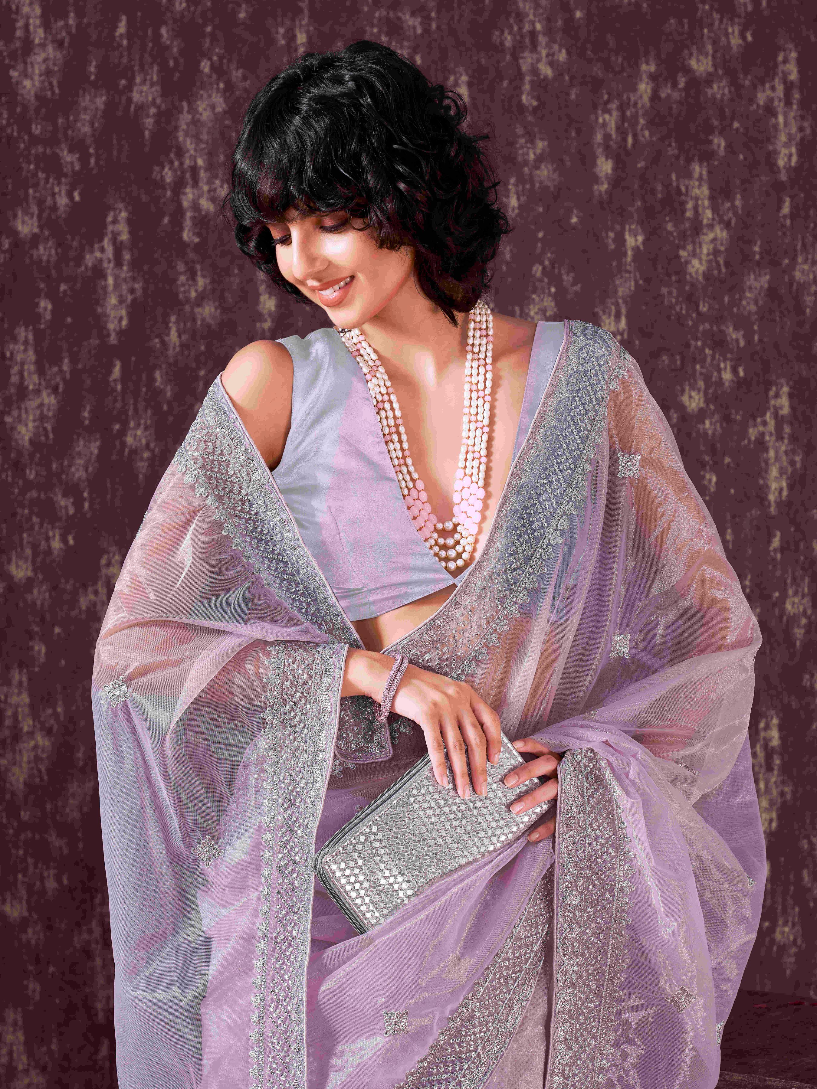 Lavendar colored shimmer net sequinned embroidered saree with embroidered blouse