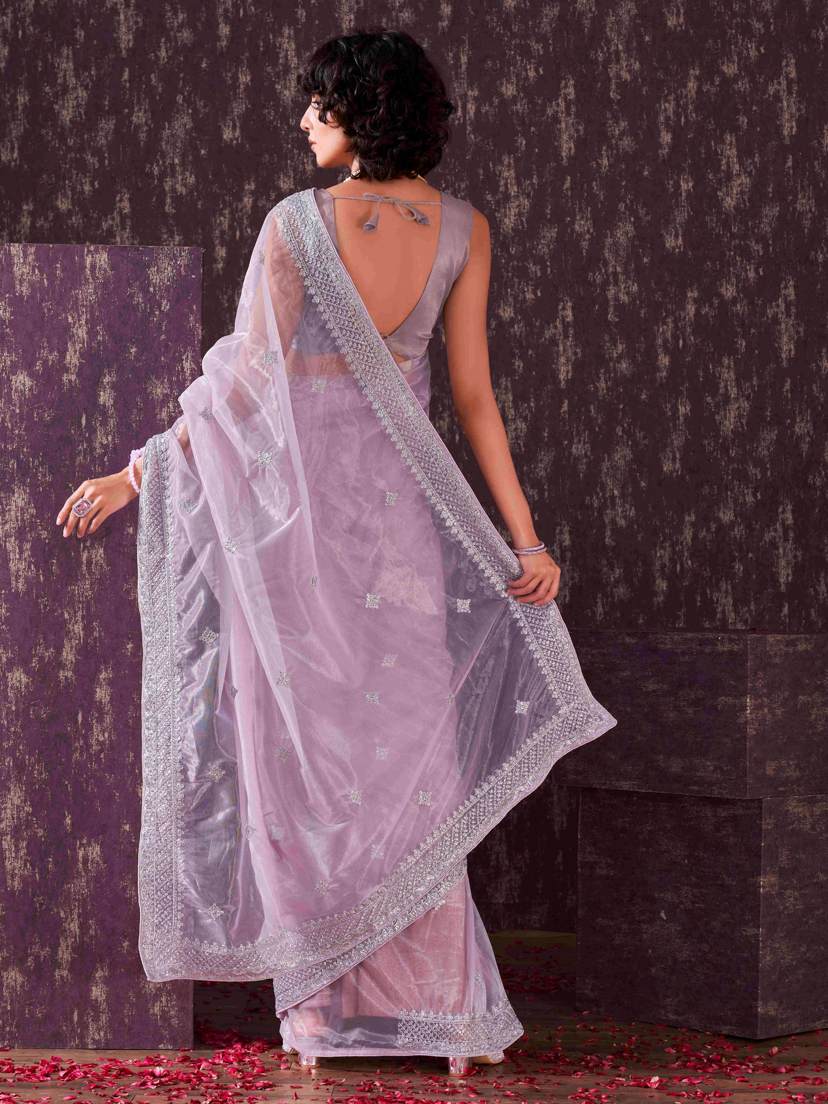 Lavendar colored shimmer net sequinned embroidered saree with embroidered blouse