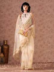 Cream colored net saree with thread work scalloped border and faux diamonds