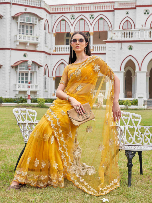 Mustard colored net saree with thread work scalloped border and faux diamonds