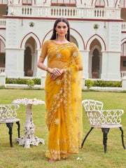 Mustard colored net saree with thread work scalloped border and faux diamonds