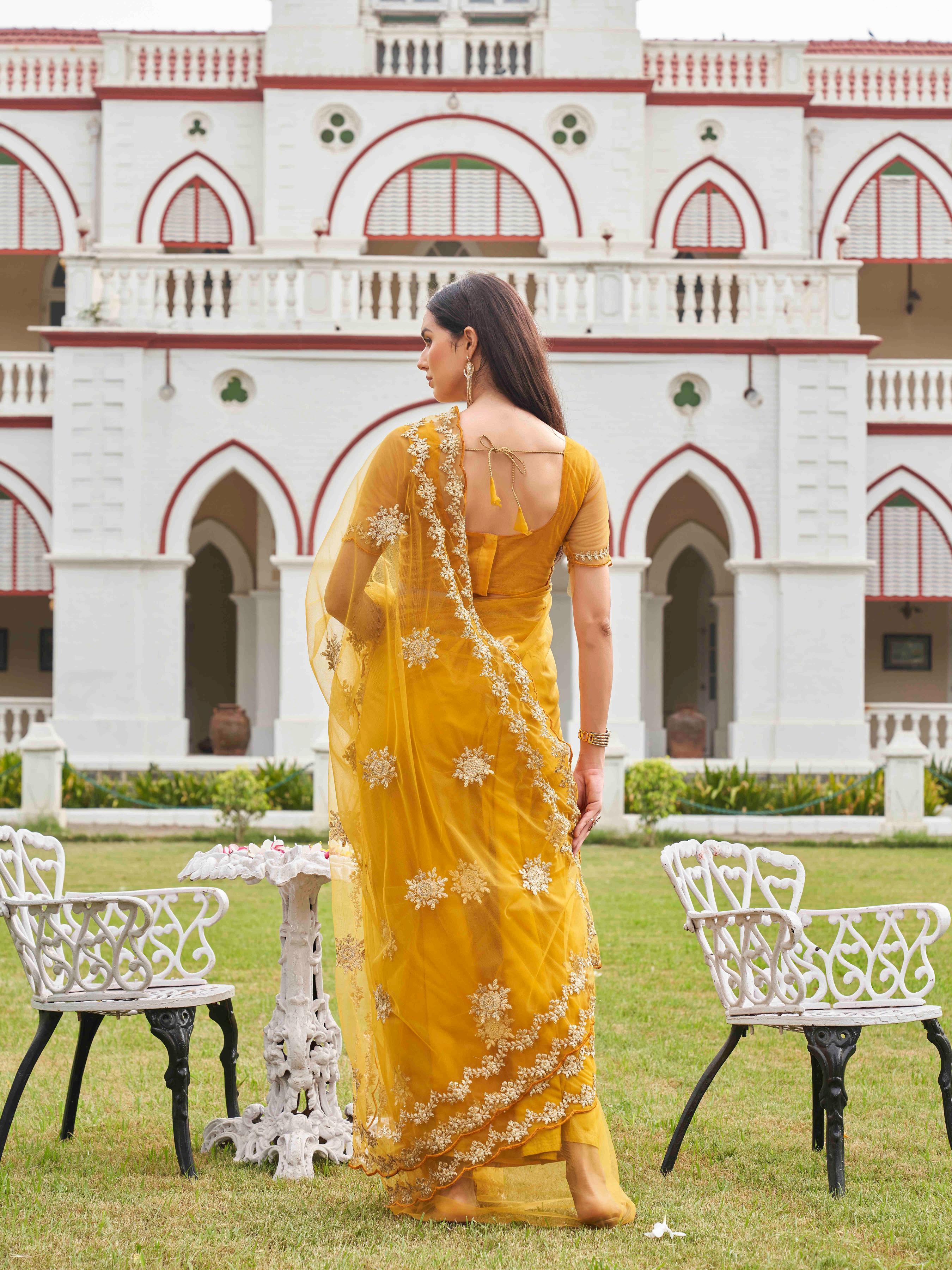 Mustard colored net saree with thread work scalloped border and faux diamonds