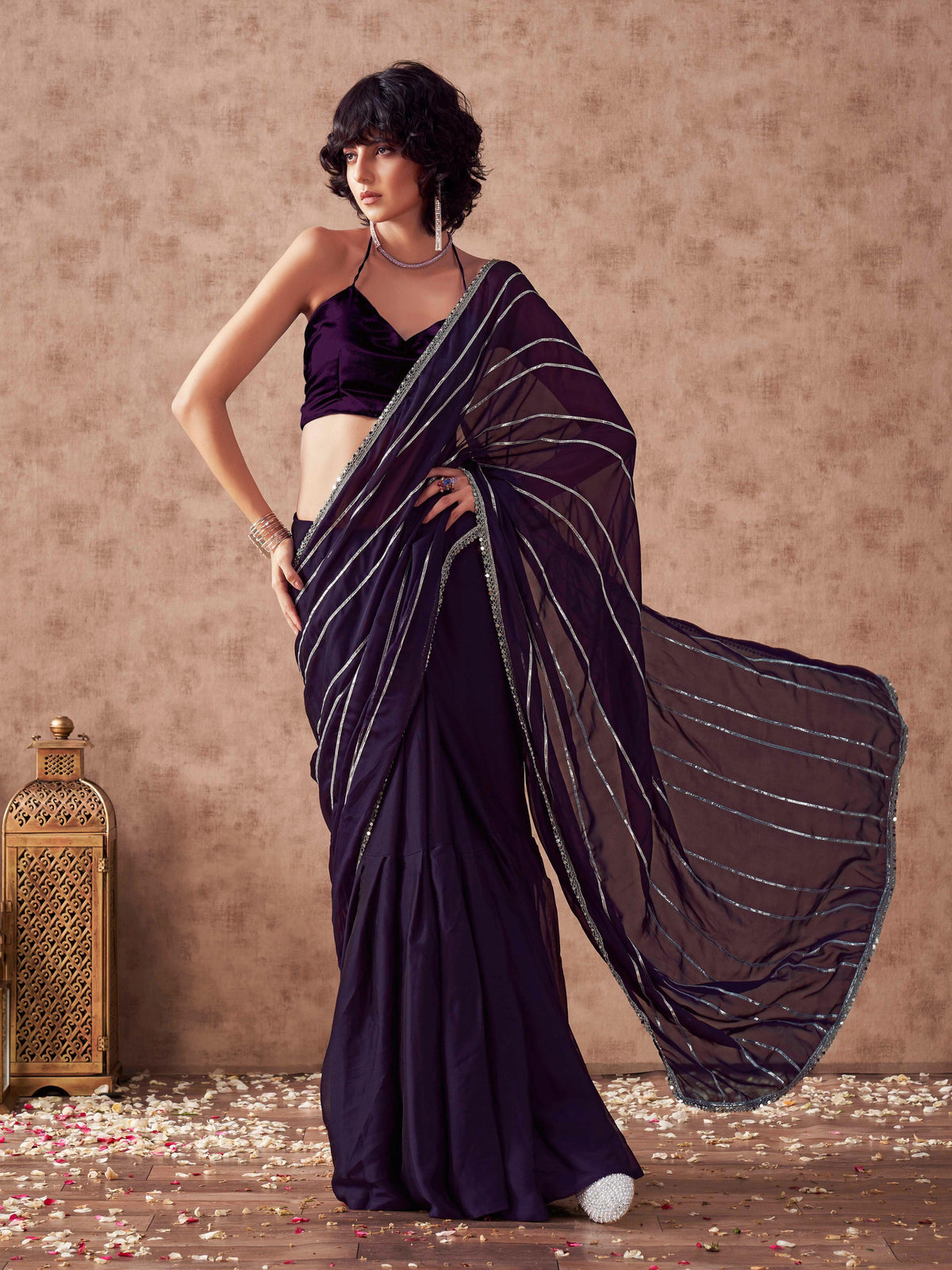 Violet colored satin saree with gota patti lining on pallu and frill on patli