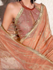 Peach colored shimmer net saree with sequence embroidery and sequinned tassle lace