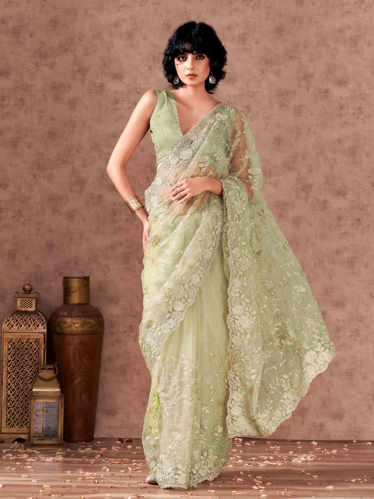 Green colored embroidered net saree  with scalloped border