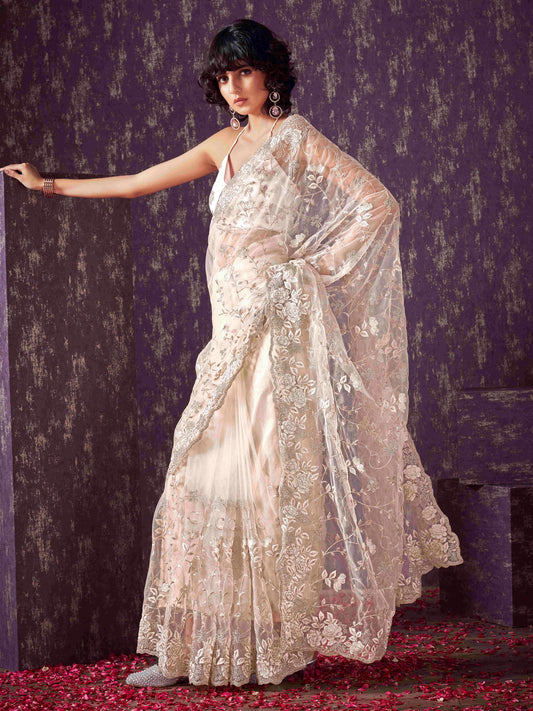 Off White colored embroidered net saree  with scalloped border