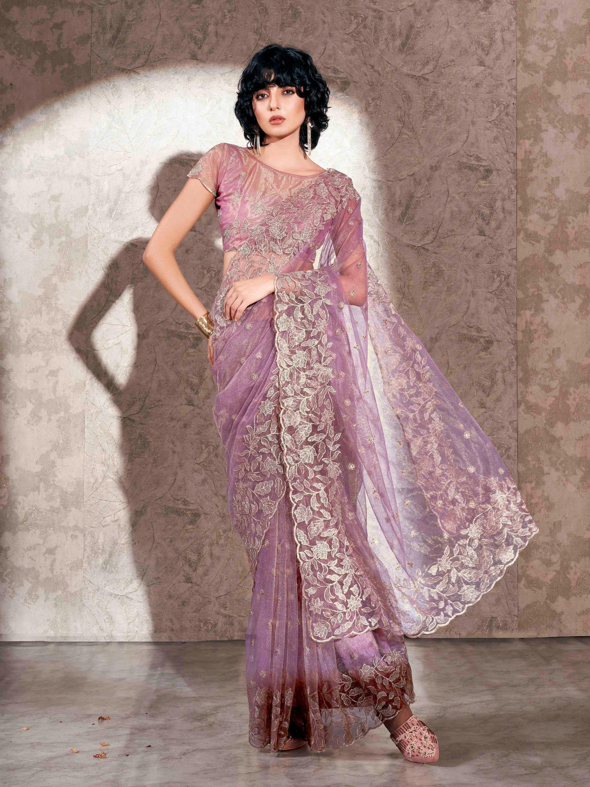 Lavendar colored shimmer net saree with jari embroidery scalloped border and faux diamonds