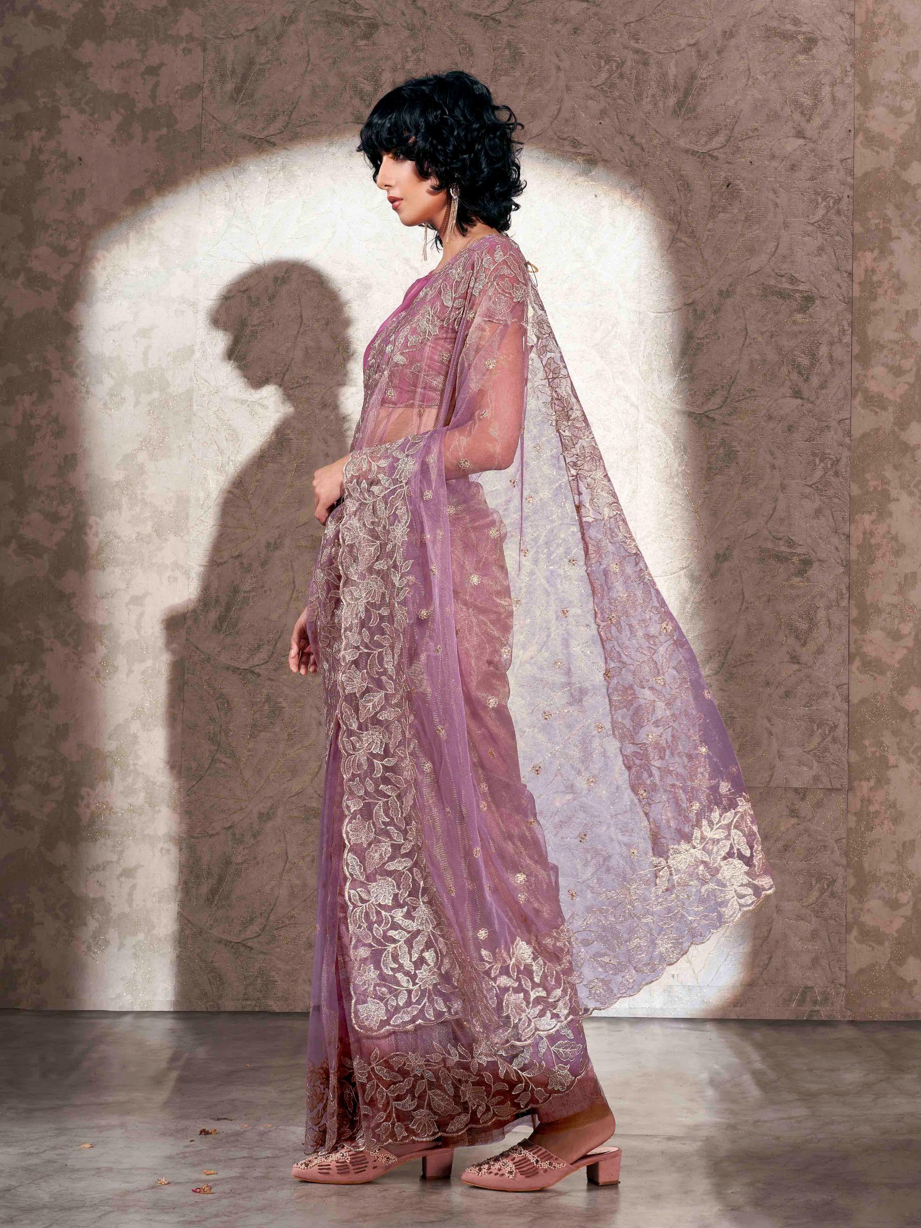 Lavendar colored shimmer net saree with jari embroidery scalloped border and faux diamonds